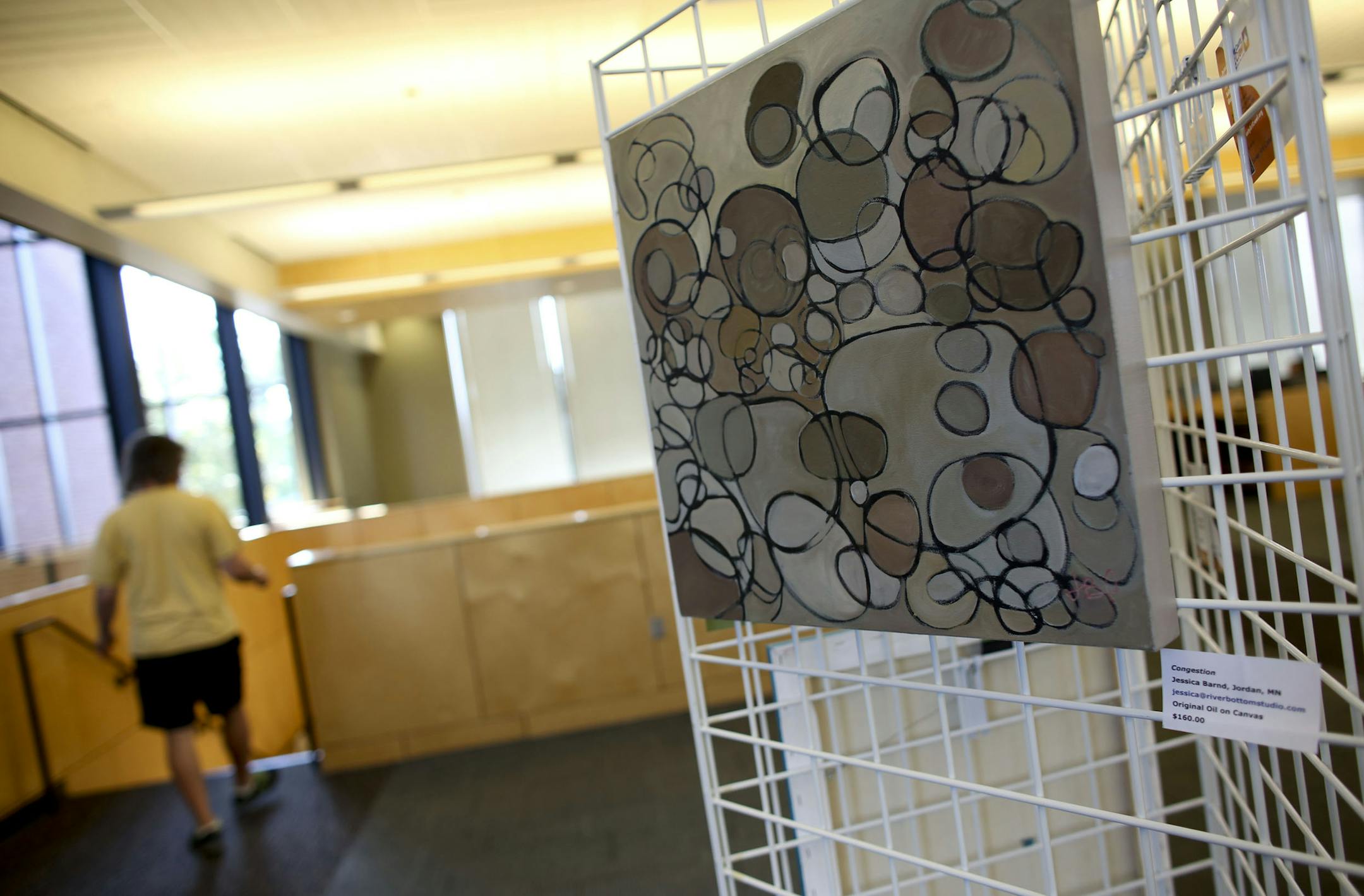 A library goer walked passed "Congestion" by Jessica Barnd, of Jordan, at the Shakopee Public Library in Shakopee Min., Wednesday, September , 2013. Barnd was one of the artist exhibiting in the Scott County Art Crawl. Some of the artists are being displayed at three different libraries before the Crawl. ] (KYNDELL HARKNESS/STAR TRIBUNE) kyndell.harkness@startribune.com ORG XMIT: MIN1309041834170922