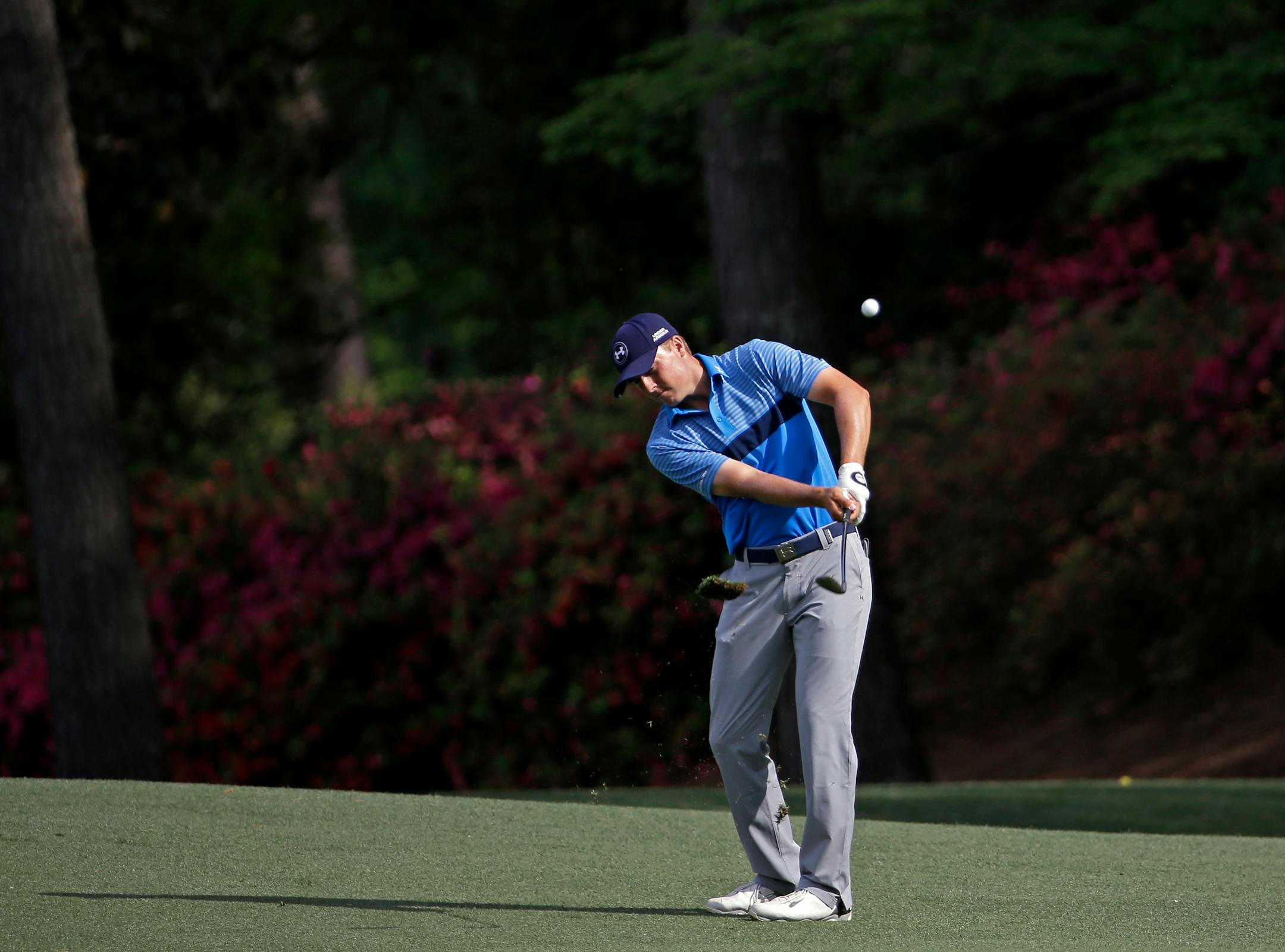 Jordan Spieth hits a chip shot during the first round of the Masters golf tournament Thursday, April 9, 2015, in Augusta, Ga. (AP Photo/David J. Phillip)