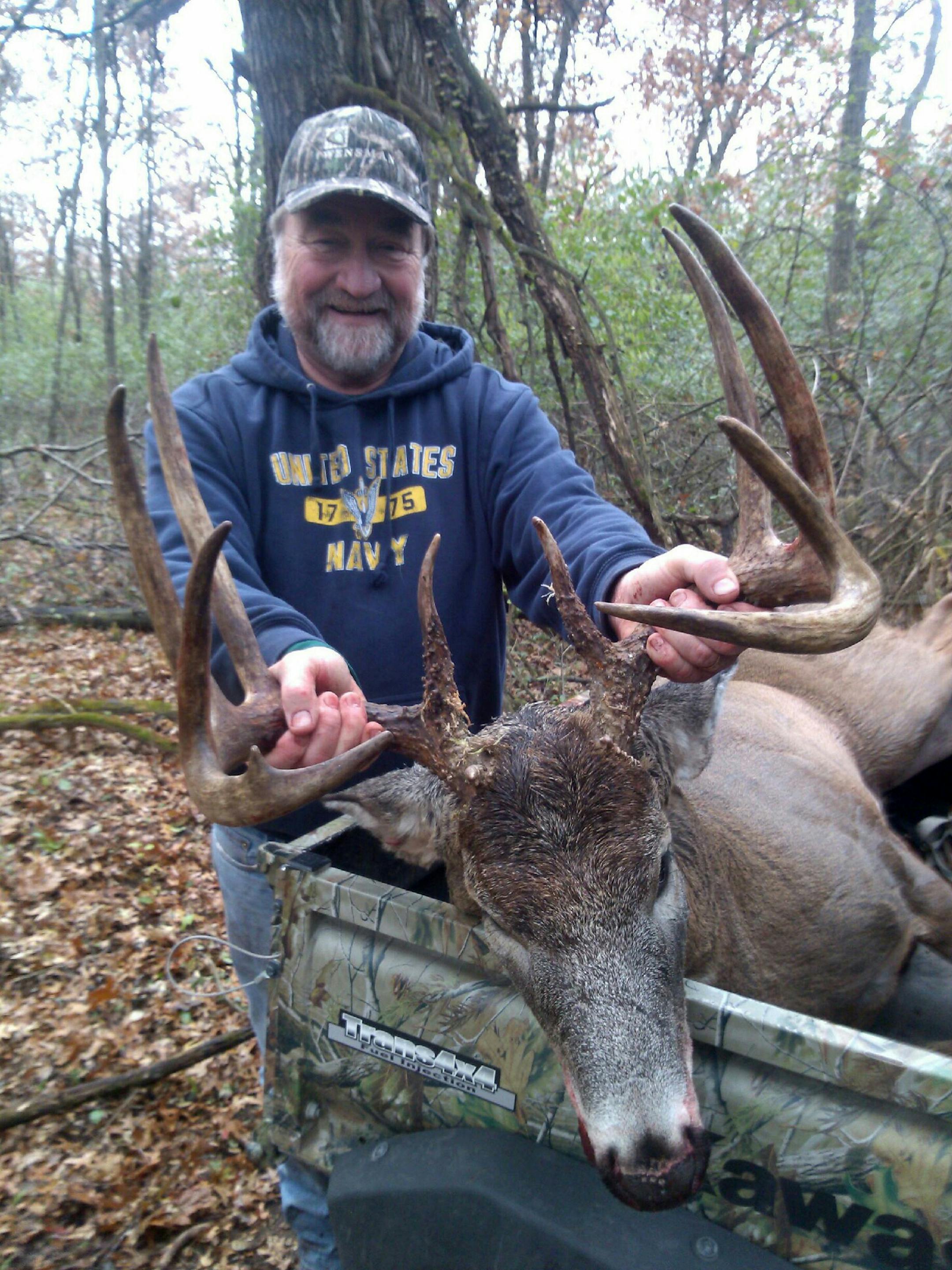 Ron Knapper, Becker, Minn., with a buck he took with a crossbow.