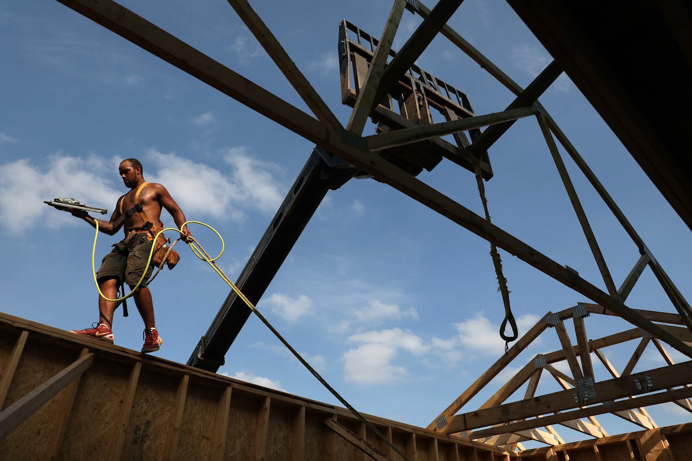 In this June 6, 2018 carpenter Caleb Morrison worked to frame out a home in Iver Grove Heights. (Staff photo by ANTHONY SOUFFLE) ORG XMIT: MIN1806070649550276