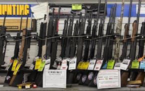 FILE-- Guns and ammunition are displayed for sale at a shop in Sacramento, Calif., on May 7, 2018. More than half a century after Lyndon Johnson fell