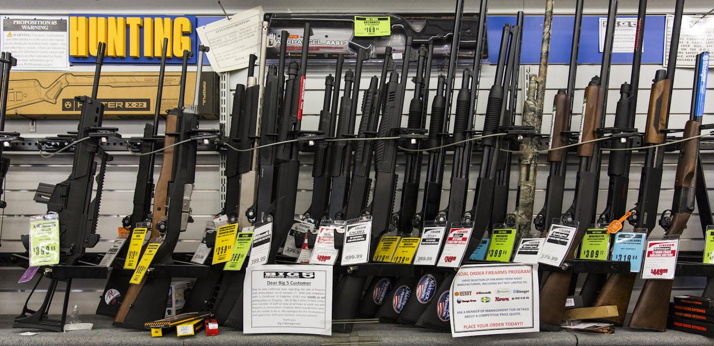 FILE-- Guns and ammunition are displayed for sale at a shop in Sacramento, Calif., on May 7, 2018. More than half a century after Lyndon Johnson fell short on his attempt at gun control, new battles bring fresh roadblocks and dispute. (Andrew Burton/The New York Times)