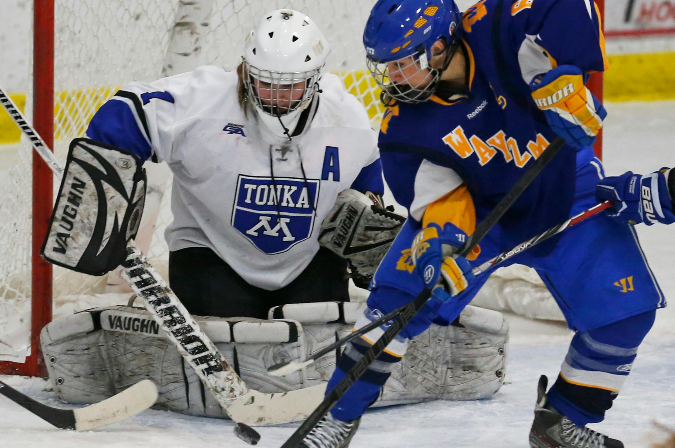Minnetonka goalie Hannah Ehresmann defended against Wayzata's Carly Noble earlier this season.