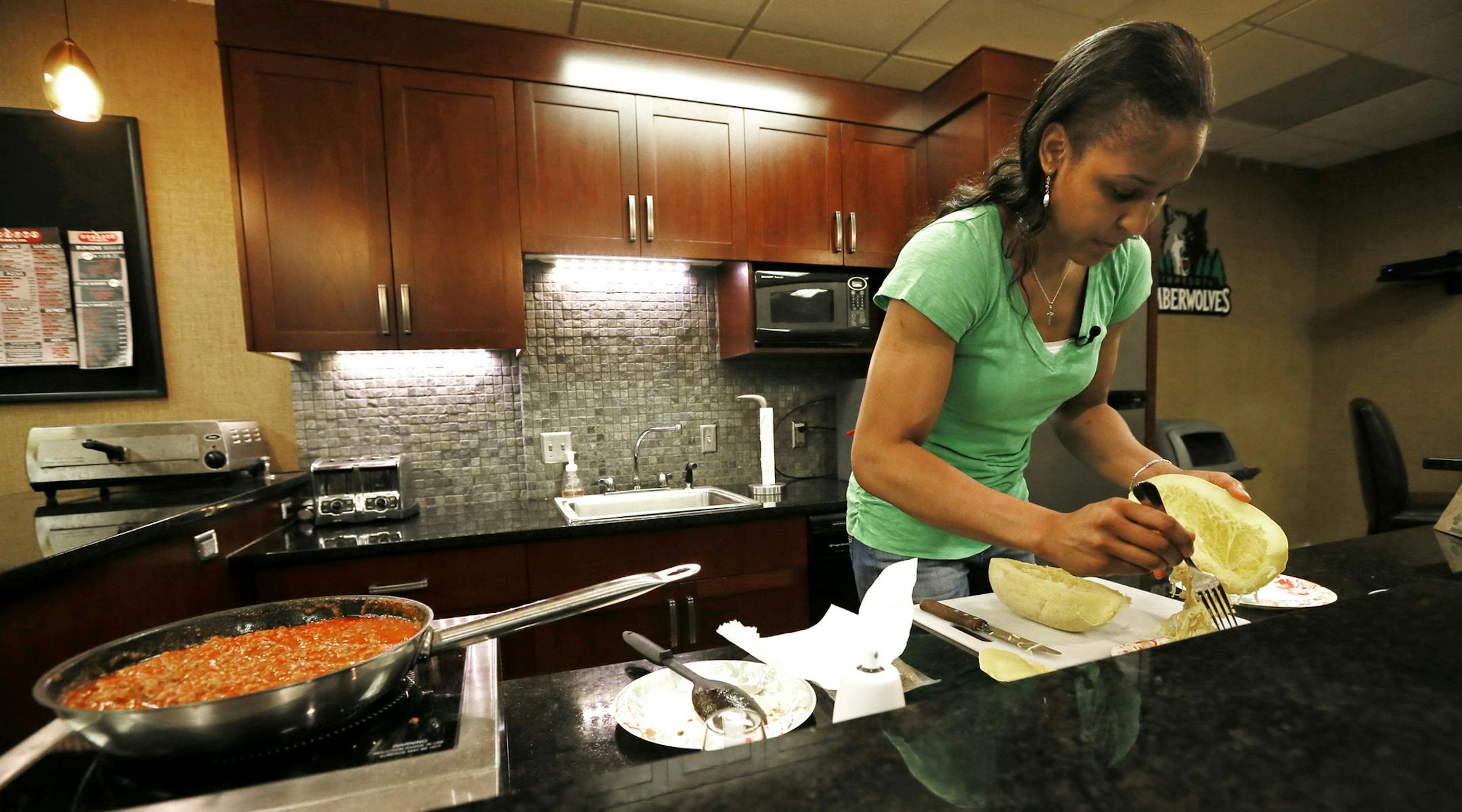 Minnesota Lynx player Maya Moore cooked up one of her favorite dishes, spaghetti squash with marinara sauce July 16 2013 . ] JERRY HOLT ‚Ä¢ jerry.holt@startribune.com