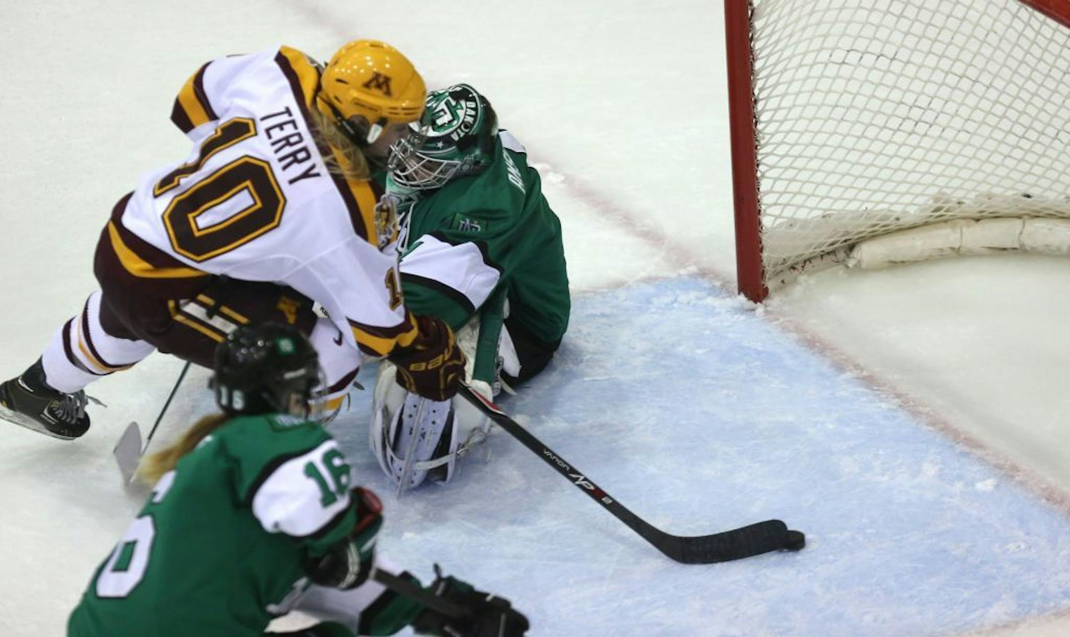 The Gophers' Kelly Terry skated past North Dakota goalie Shelby Amsley-Benzie to score during the first period at Ridder Arena on Saturday.