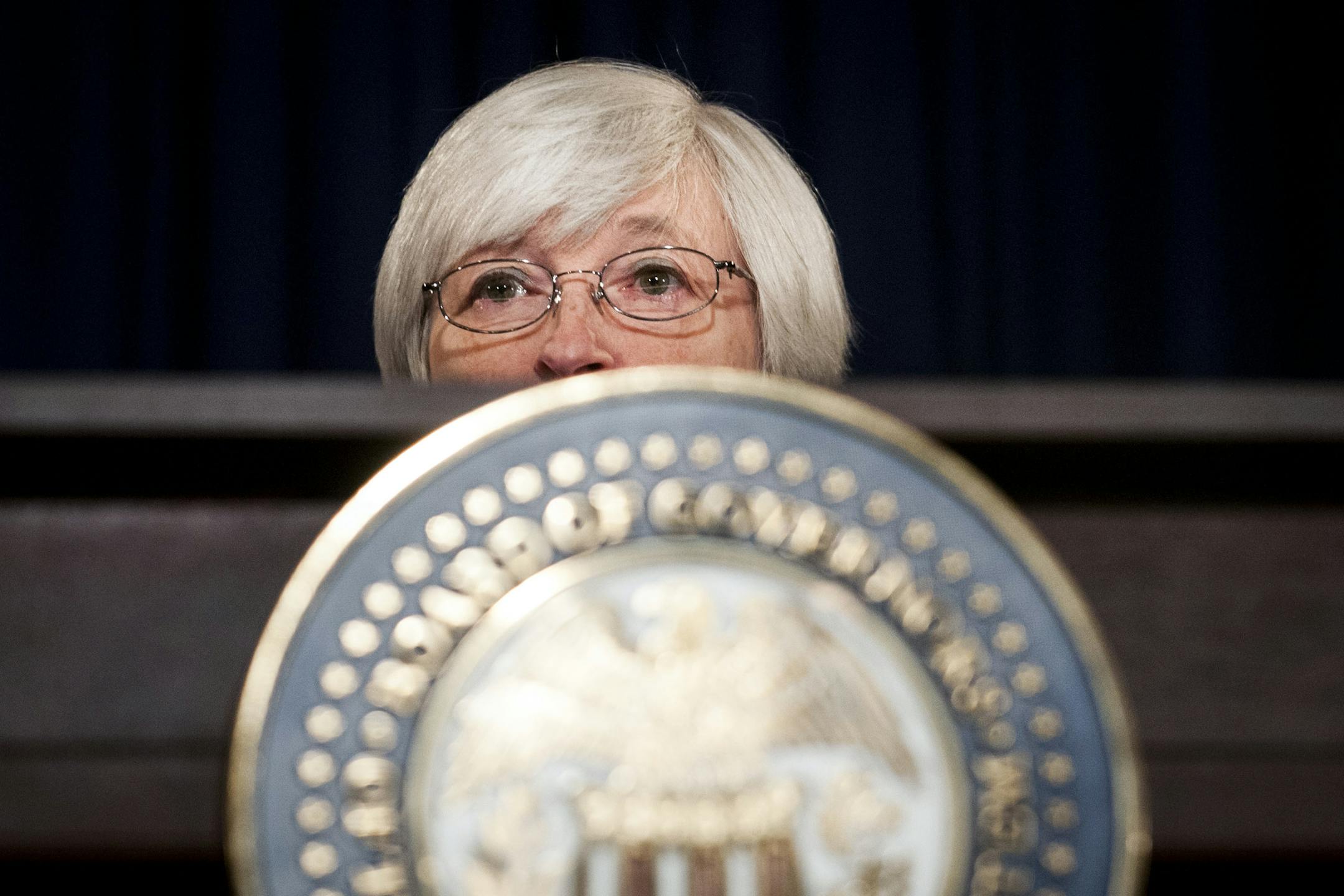 Federal Reserve Borad Chairwoman Janet Yellen speaks at a news conference on the state of the economy, in Washington, March 19, 2014. The Fed further curtailed its economic stimulus campaign Wednesday, announcing as expected that it would reduce its monthly bond purchases because of the progress of the economic recovery. (Gabriella Demczuk/The New York Times)