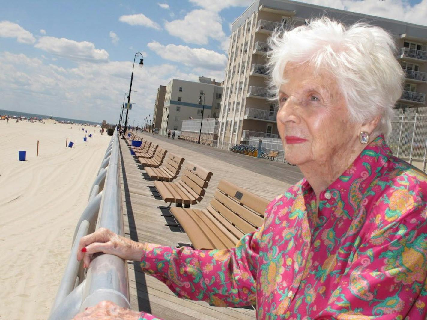 In this July 22, 2015 photo, Lucille Horn stands on the boardwalk outside her home in Long Beach, N.Y. Horn was one of thousands of so-called "incubator babies" put on display at an exhibition in Coney Island by Dr. Martin Couney in the early 20th Century after they were born. In the decades preceding World War II, premature infants in primitive incubators were put on display at the World's Fair, Coney Island and elsewhere, the only apparent option for parents intent on not letting their babies