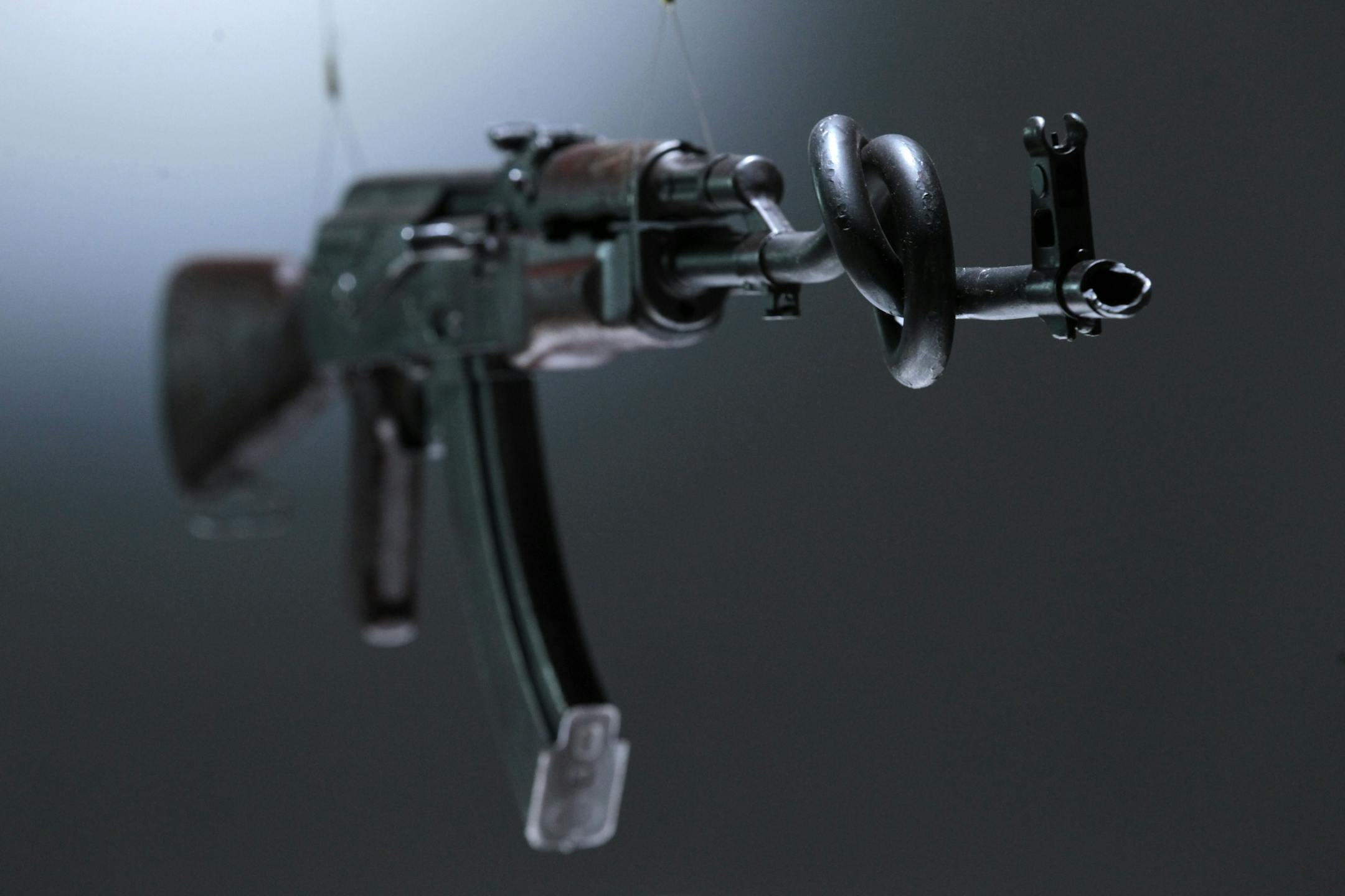 An interpretation of an AK-47 assault rifle by British artists Tim Noble and Sue Wenster is seen on display in an exhibition 'AKA Peace' at the Institute of Contemporary Arts in London, Wednesday, Sept. 26, 2012. The exhibition in collaboration with non-profit organization Peace One Day showcases artists reinterpretation of AK-47 assault rifles, reacting against the horror of violence globally, recasting a weapon of devastation as a conduit to peace. The art installations are to be auctioned aft