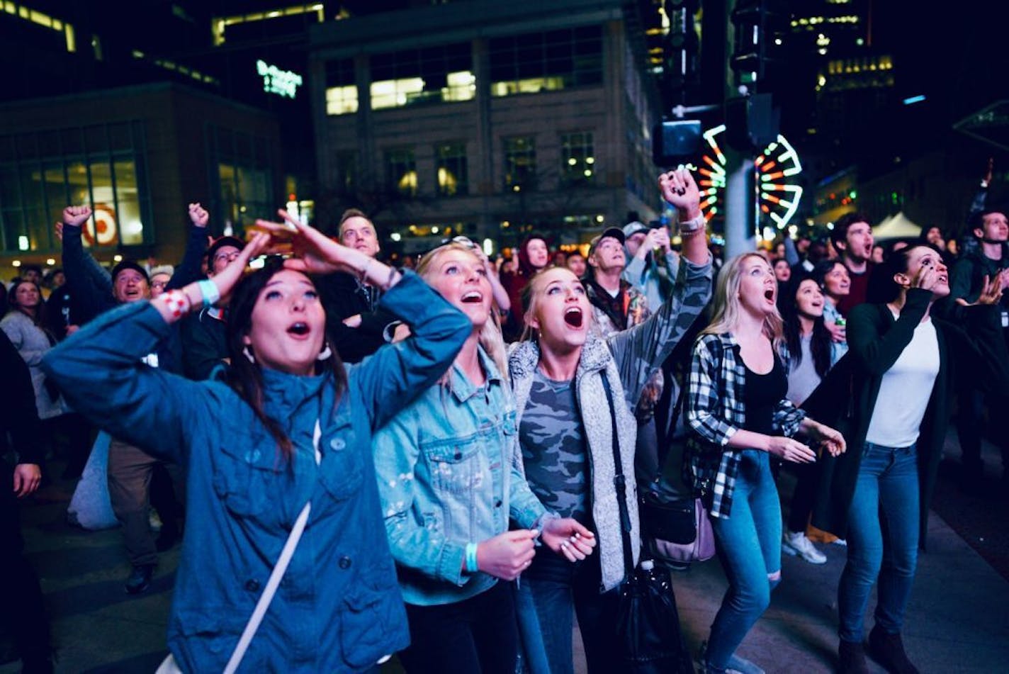 Fans reacted on Nicollet Mall at the end of Monday night's championship game in Minneapolis. Virginia won 85-77 in overtime over Texas Tech.