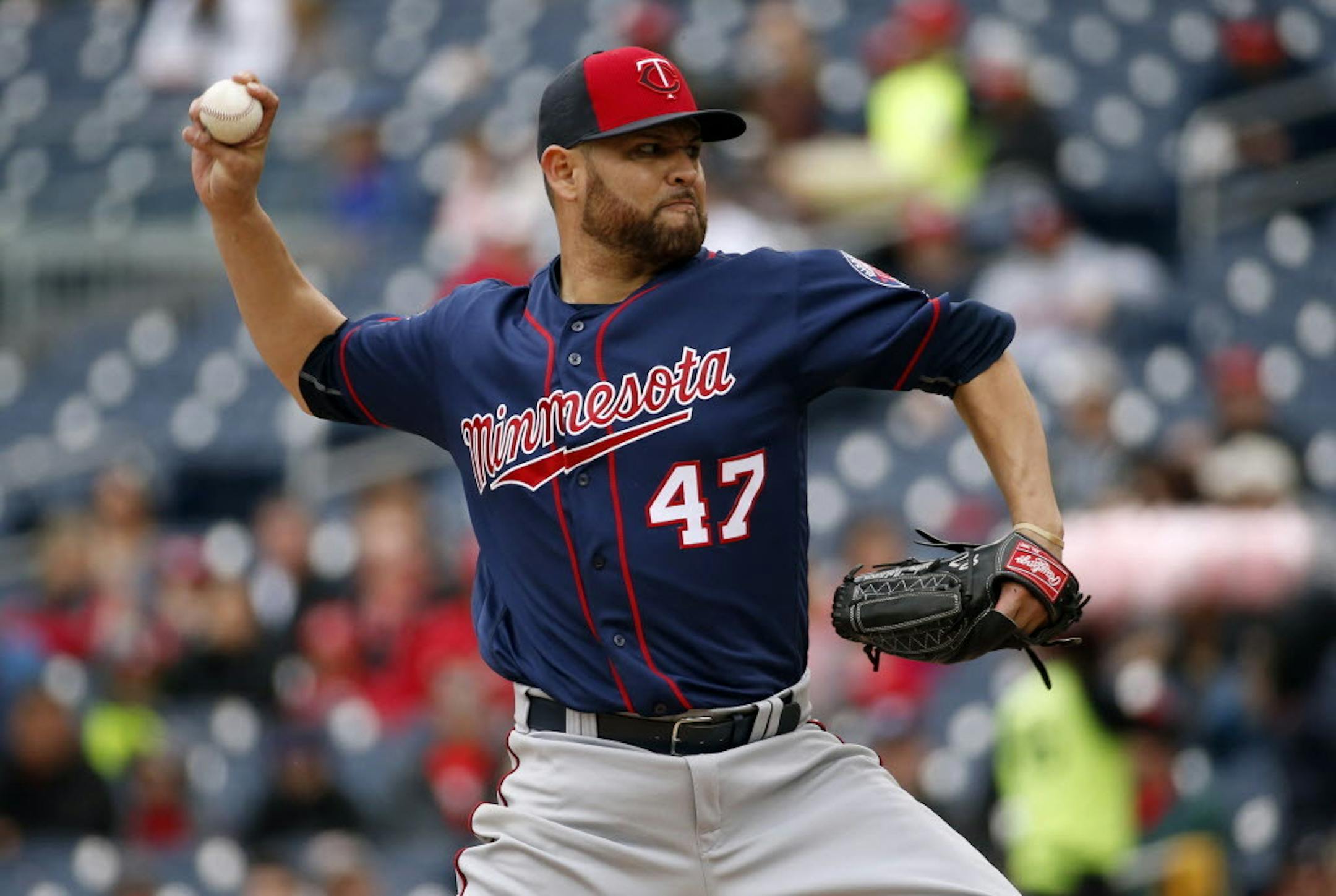 Minnesota Twins starting pitcher Ricky Nolasco throws during the third inning of an exhibition baseball game against the Washington Nationals, at Nationals Park, Saturday, April 2, 2016, in Washington.