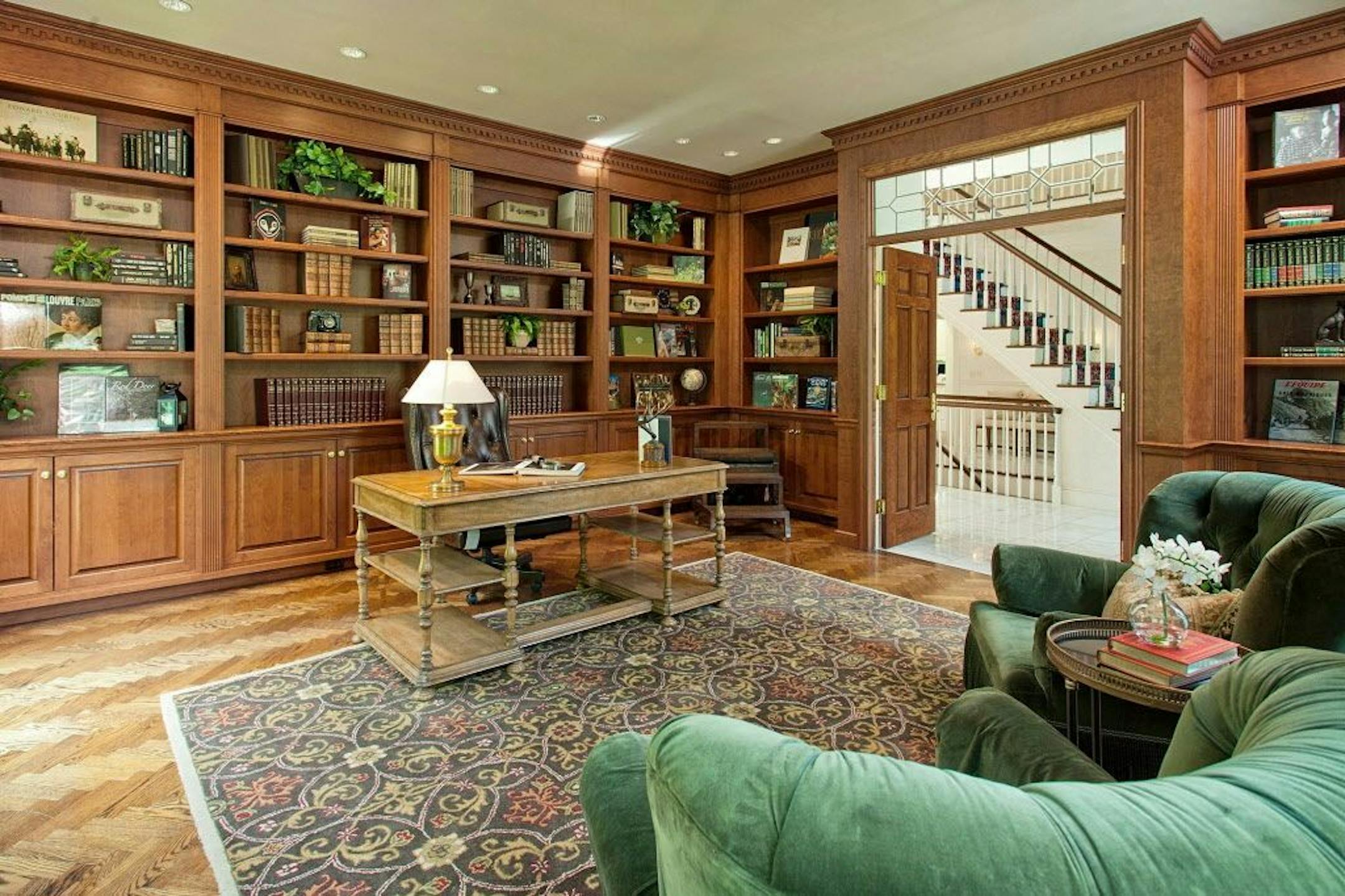 Cherry-paneled library with built-in bookcases.