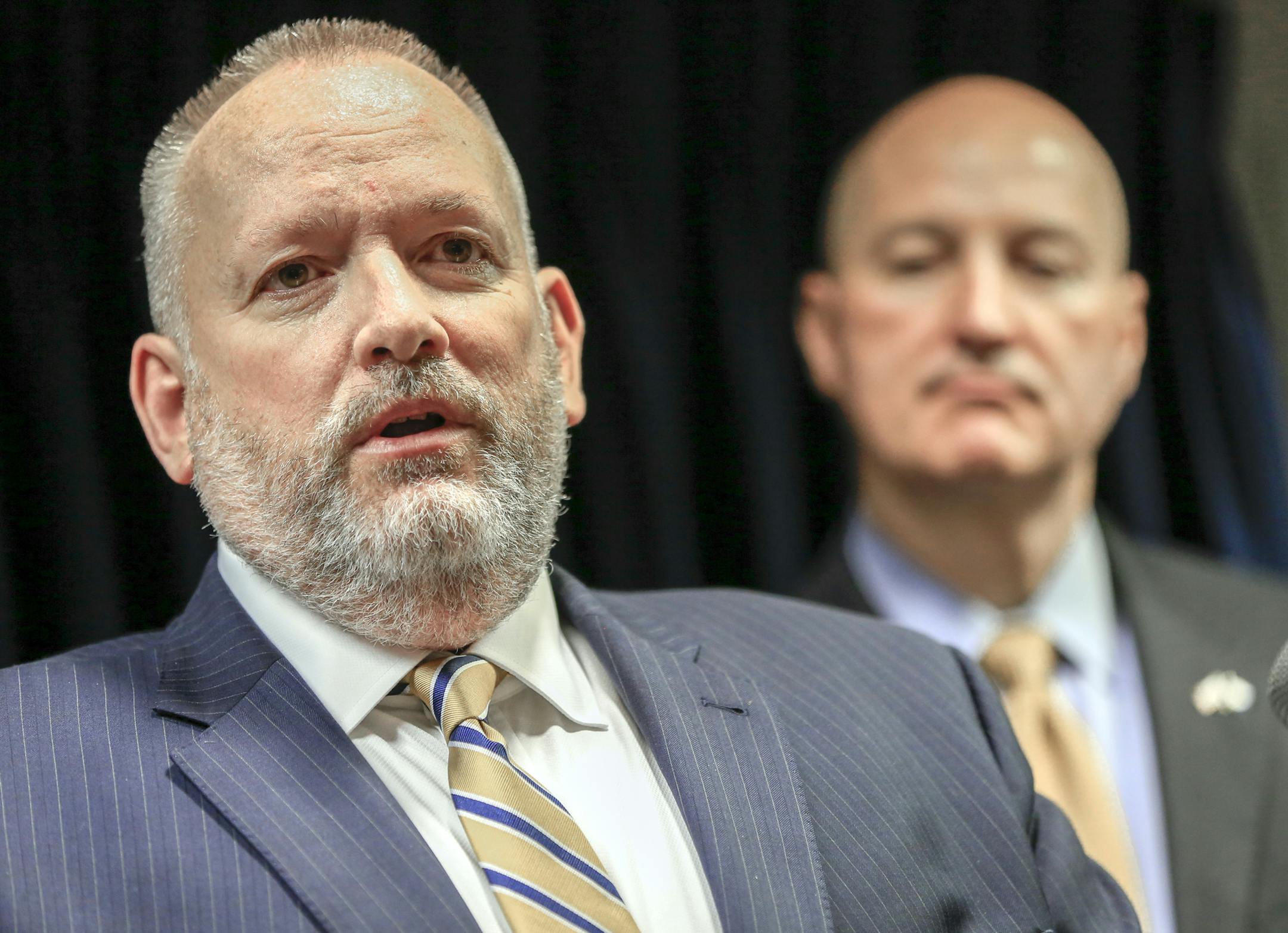 U.S. Drug Enforcement Administration Acting Administrator Robert Patterson, left, speaks in Omaha, Neb., Thursday, June 7, 2018, in front of Neb. Gov. Pete Ricketts. The DEA is establishing a new field division based in Omaha that will include Nebraska, Iowa, Minnesota, North Dakota and South Dakota. DEA Acting Administrator Patterson said the move was prompted in part by the nation's growing opioid crisis. (AP Photo/Nati Harnik)