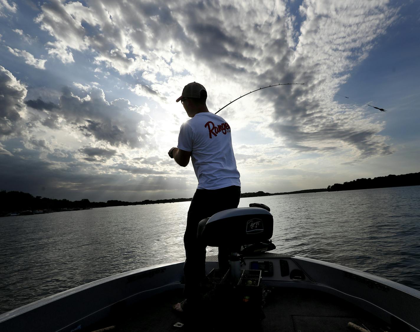 Fishing guide Travis Frank casted his lure into Lake Waconia. ] CARLOS GONZALEZ cgonzalez@startribune.com - June 8, 2016, Waconia, MN, Outdoors Weekend, Meeting Muskie angler Travis Frank to fish Lake Waconia