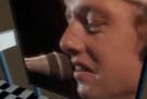 Mark Knopfler of Dire Straits, in the band's music video for "Money for Nothing."