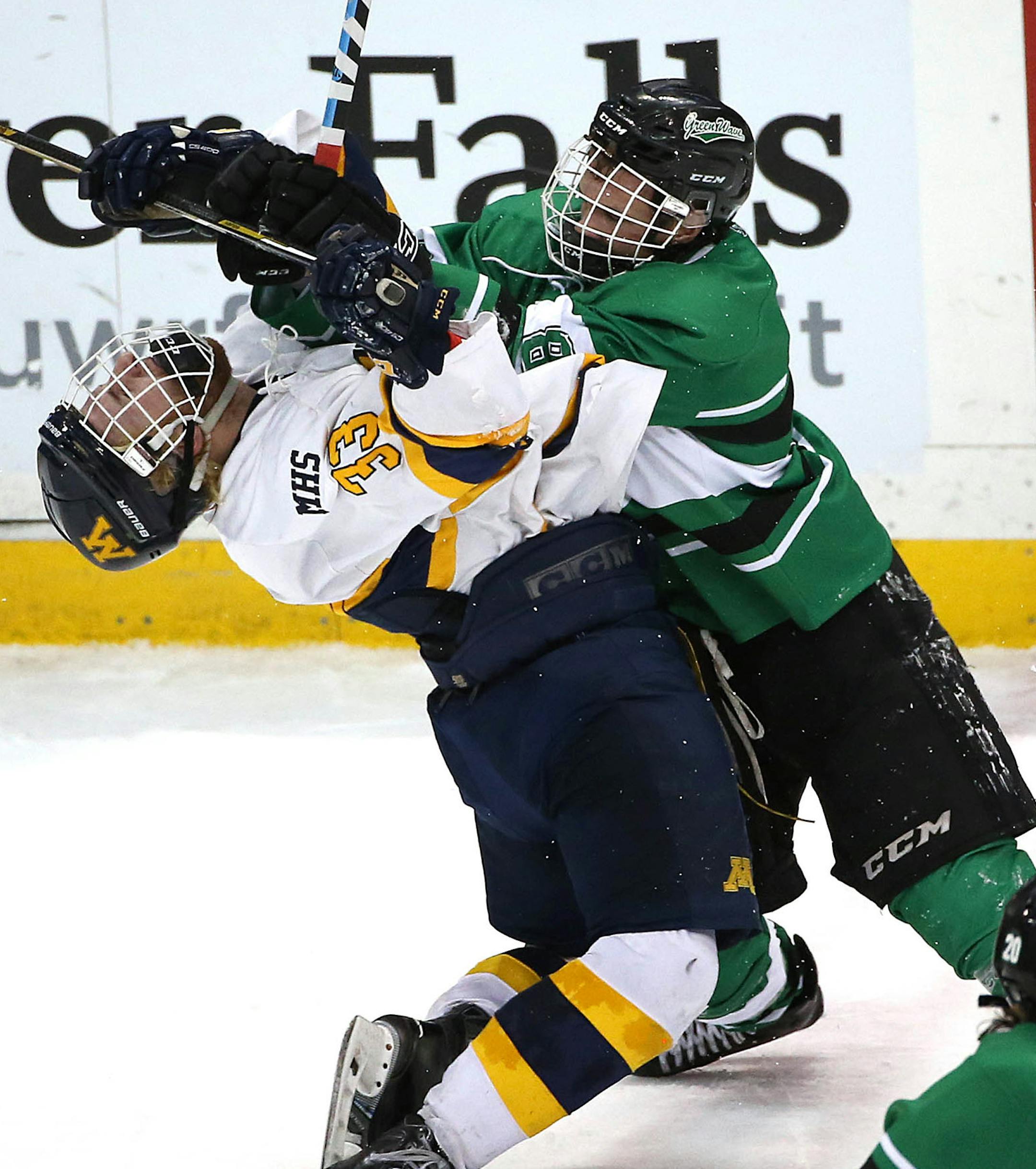 Mahtomediís Jack Gunderson (left) collided with East Grand Forkís Austin Monda in the second period. ] JIM GEHRZ ï james.gehrz@startribune.com / Minneapolis, MN / March 6, 2015 /11:00 AM ñ BACKGROUND INFORMATION: Mahtomedi High School played East Grand Forks in the Class A semifinals of the 2015 Minnesota Boys High School Hockey State Tournament Friday at the Xcel Energy Center.