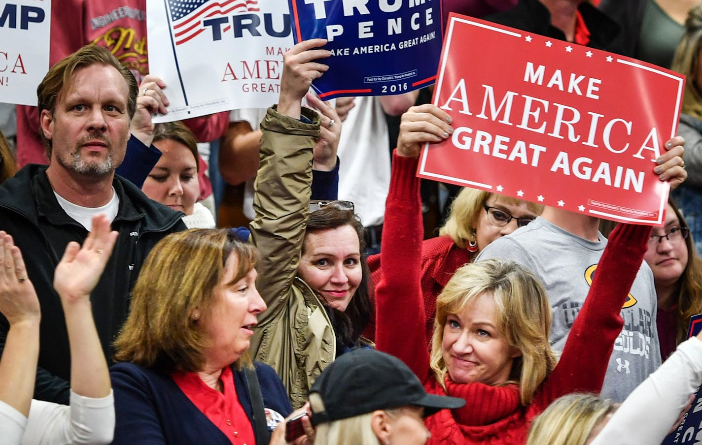 Donald Trump supporters cheered after the national anthem at the University of Wisconsin-Eau Claire. ] GLEN STUBBE * gstubbe@startribune.com Tuesday, November 1, 2016 Republican presidential candidate Donald Trump holds a rally on the campus of the University of Wisconsin-Eau Claire. ORG XMIT: MIN1611011725290266