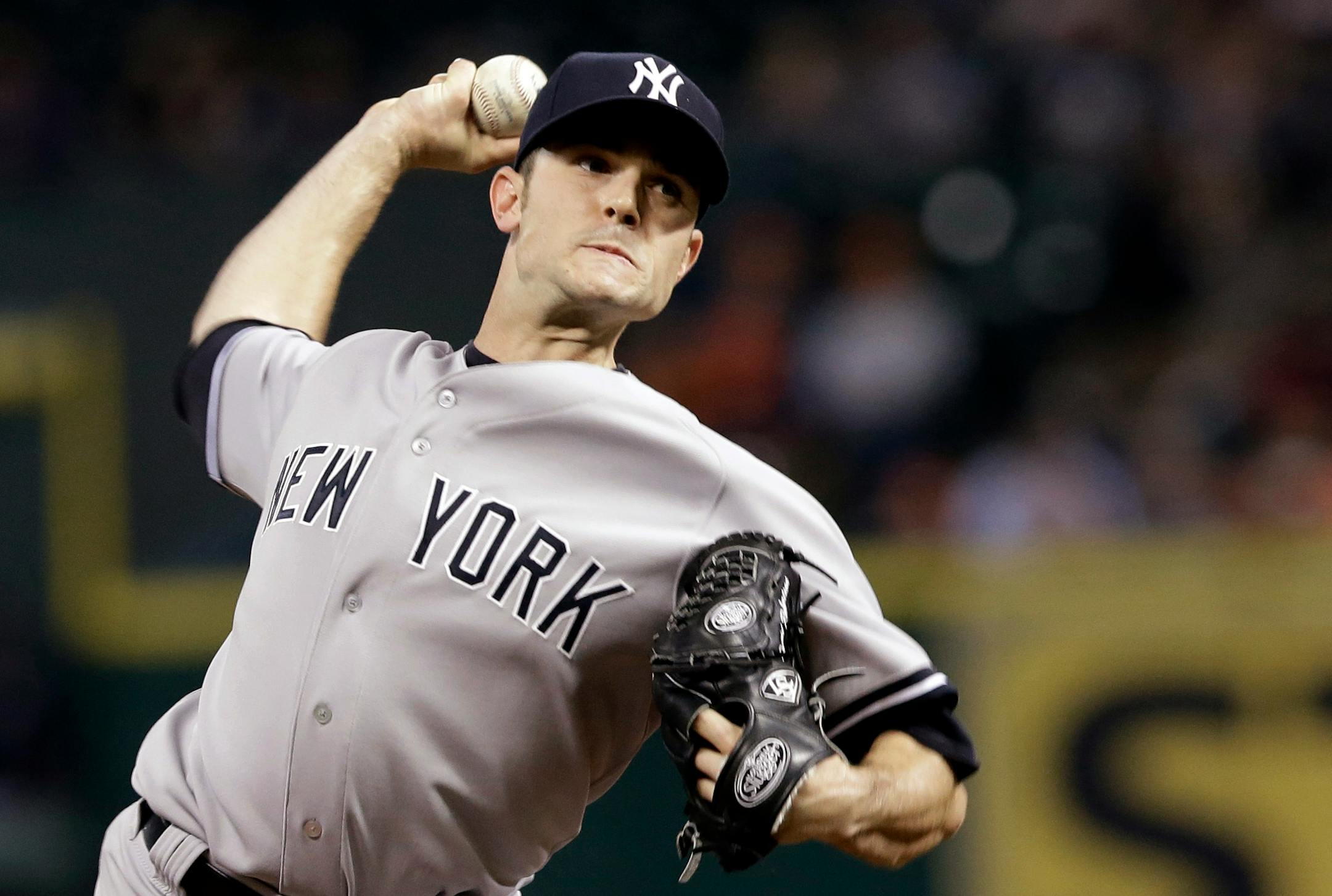 FILE - In this April 3, 2014, file photo, New York Yankees closer David Robertson delivers a pitch against the Houston Astros in the ninth inning of a baseball game in Houston. Robertson is leaving the New York Yankees after one season as closer, agreeing to a $46 million, four-year contract with the Chicago White Sox.