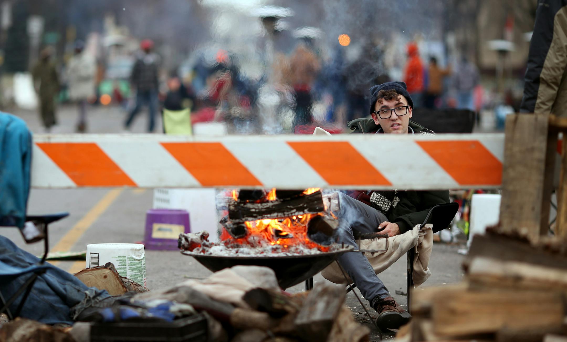 Black Lives Matters protesters continued to burn fires to keep warm on the 15 day in front of the 4th precinct Sunday November 29, 2015 in Minneapolis, MN.] Jerry Holt /Jerry.Holt@Startribune.com