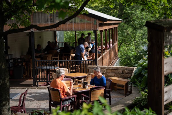 Craig and Mary Kantenwein dine on one of Juniper's outdoor spaces this summer in Lanesboro.