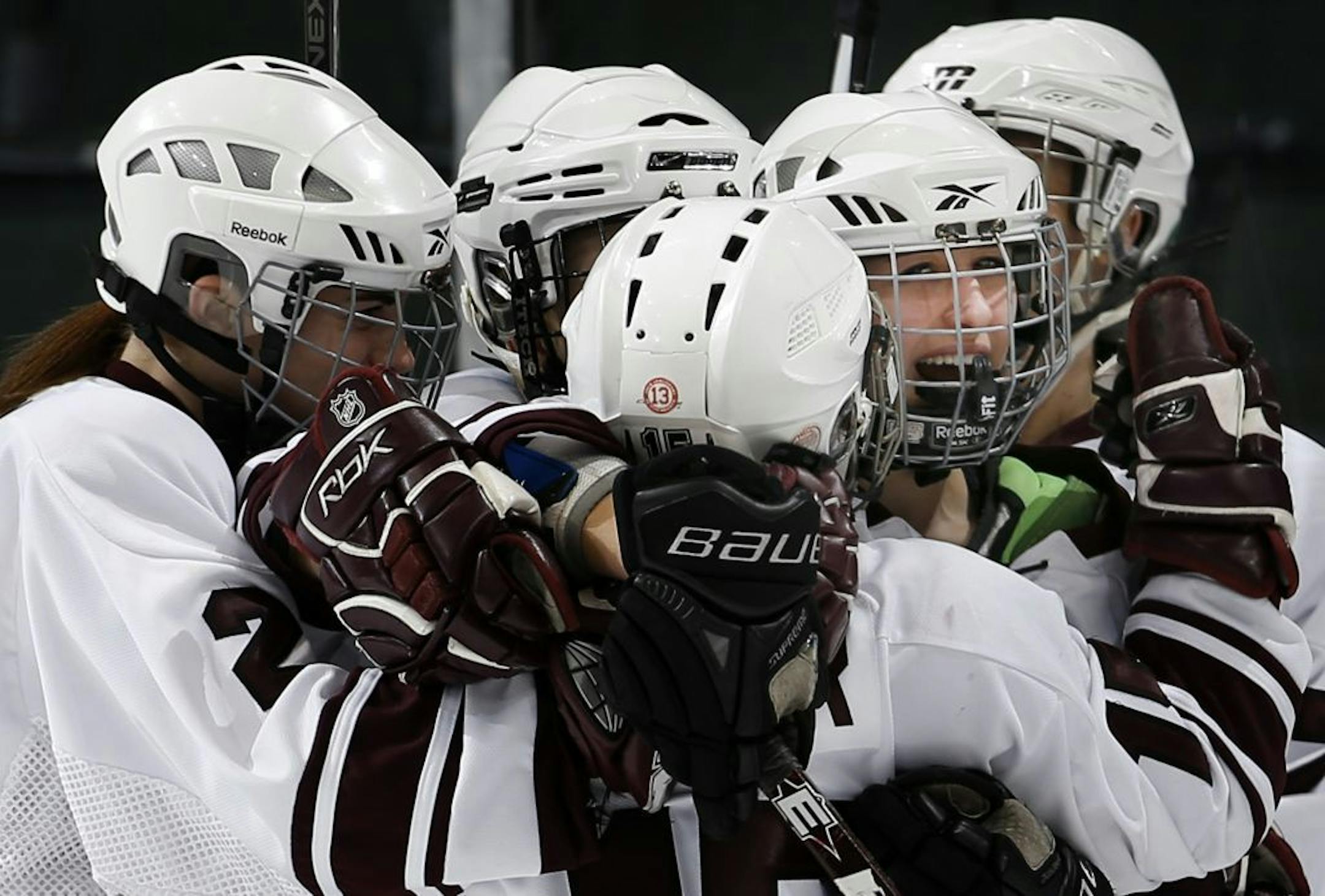 South St. Paul celebrated a goal by Bridgette Miller (20) (facing camera) in the third period. South St. Paul beat Hibbing/Chisholm by a final score of 3-0.