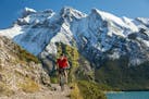 In a photo provided by Paul Zizka, Biking near the glacial Lake Minnewanka in the Banff area. The country plans to open to vaccinated travelers from t