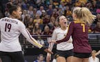 Minnesota Setter Sara Nielsen (3) congratulates Minnesota DS/Libero CC McGraw (7) on a save that led to winning the point. [ Special to Star Tribune, 