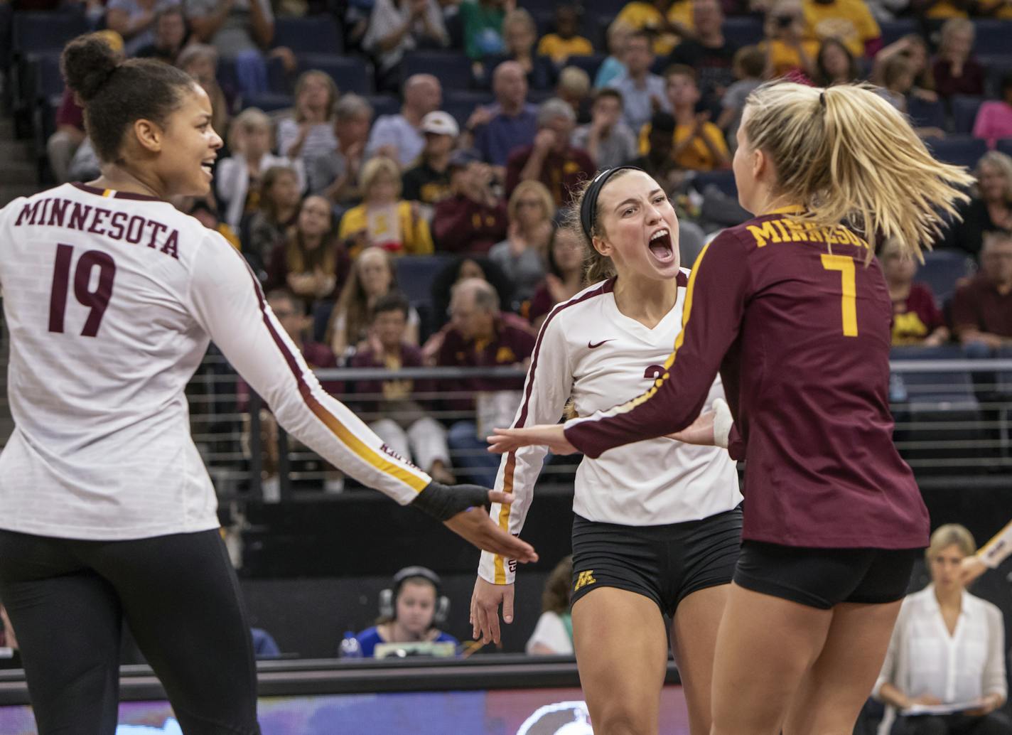 Minnesota Setter Sara Nielsen (3) congratulates Minnesota DS/Libero CC McGraw (7) on a save that led to winning the point. [ Special to Star Tribune, photo by Matt Blewett, Matte B Photography, matt@mattebphoto.com, NCAA Volleyball, University of Minnesota, Florida State, August 24, 2018, Target Center, Minneapolis, Minnesota, SAXO 1006669803 UVOL082518