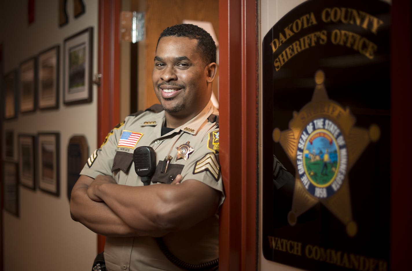 Sgt. Booker Hodges, with the Dakota County Sheriff's Office, was photographed outside his office on Tuesday afternoon. . ] Aaron Lavinsky &#x2022; aaron.lavinsky@startribune.com Booker Hodges, a Dakota County sheriff's office commander, recently became the first officer of color to receive a doctorate from Hamline University. Hodges emerged from a trying childhood in north Minneapolis. His mother died when he was 12 after years of abuse by his father, and a classmate was gunned down during high