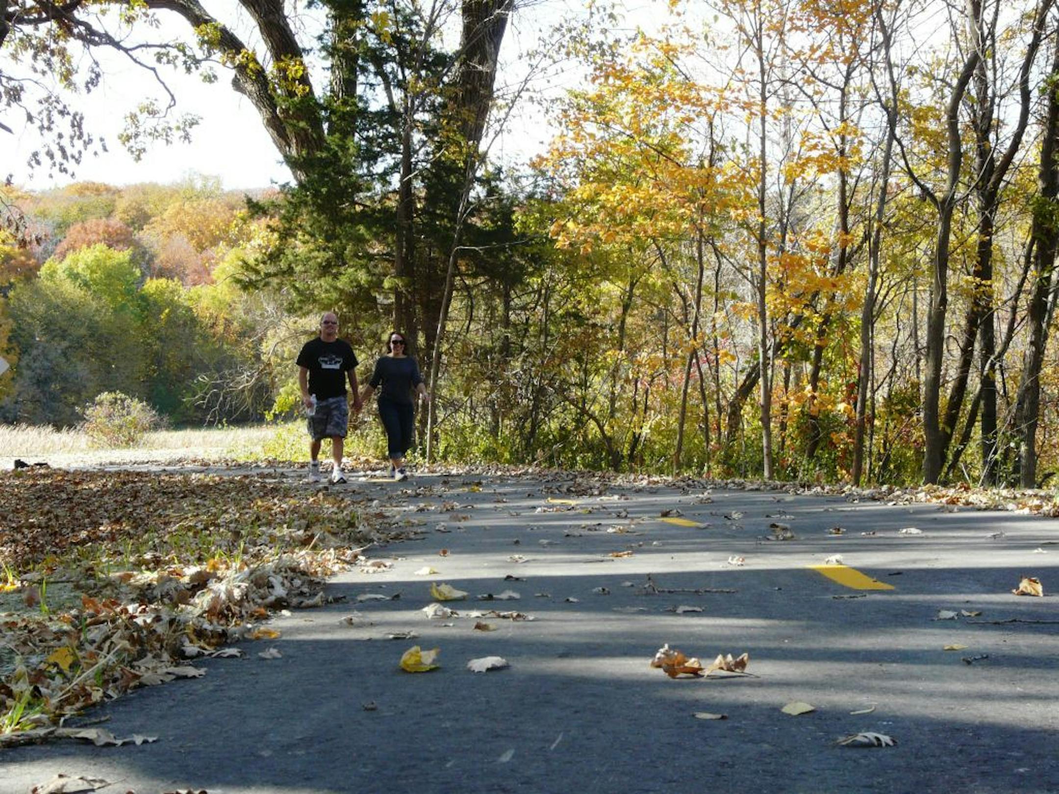 DAVID PETERSON Nearby residents Matt May and Rachel Halstrom enjoy the trails before officially opening.