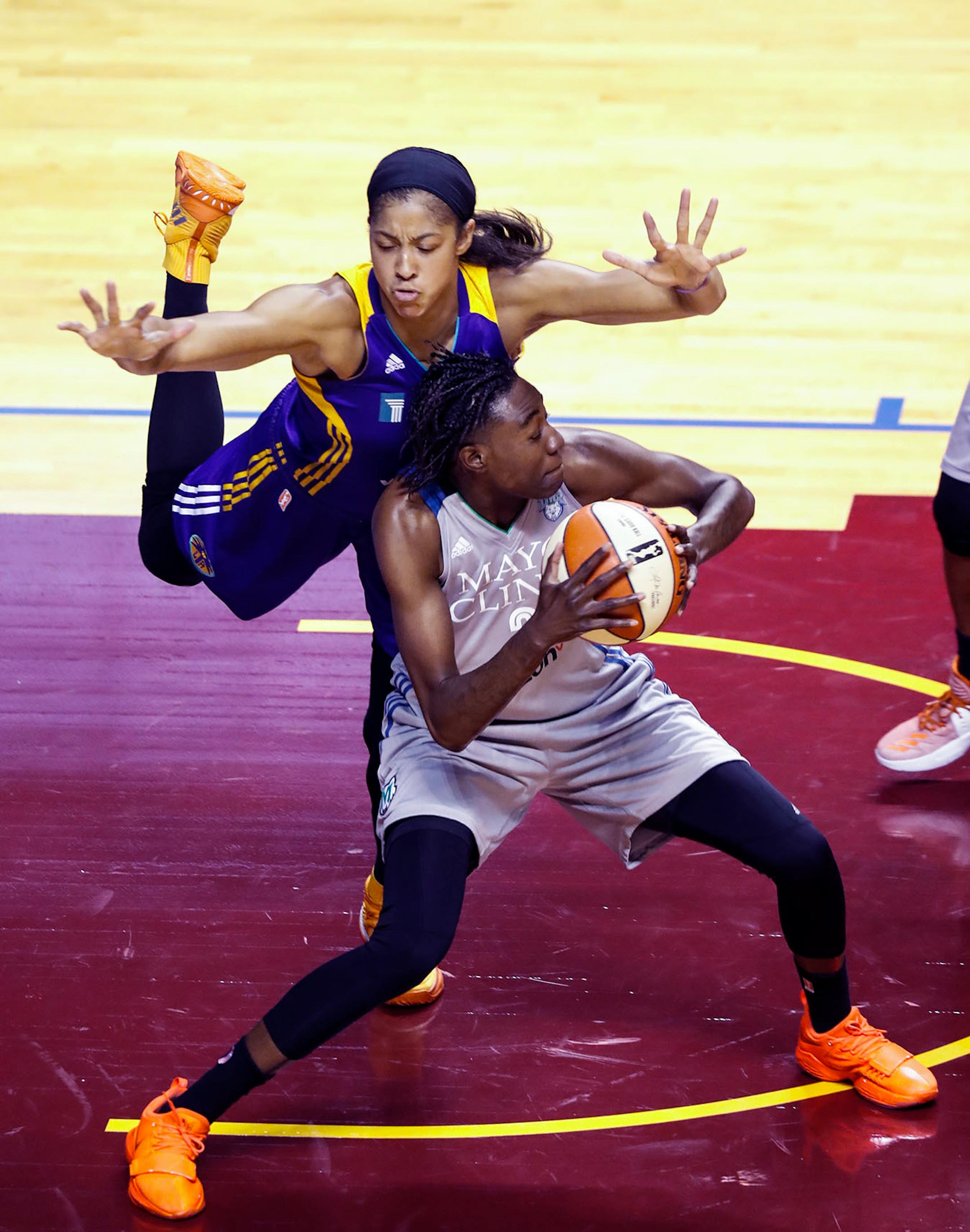 Minnesota Lynx forward Natasha Howard (3) looked to get around Los Angeles Sparks forward Candace Parker (3) during the first half.