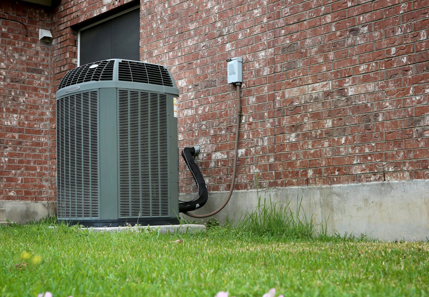 High efficiency modern AC-heater unit on brick wall background