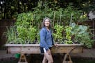 Lindsay Brice appreciates the fresh vegetables growing in her backyard garden in St. Paul. The garden was installed and is tended by A Backyard Farm, 