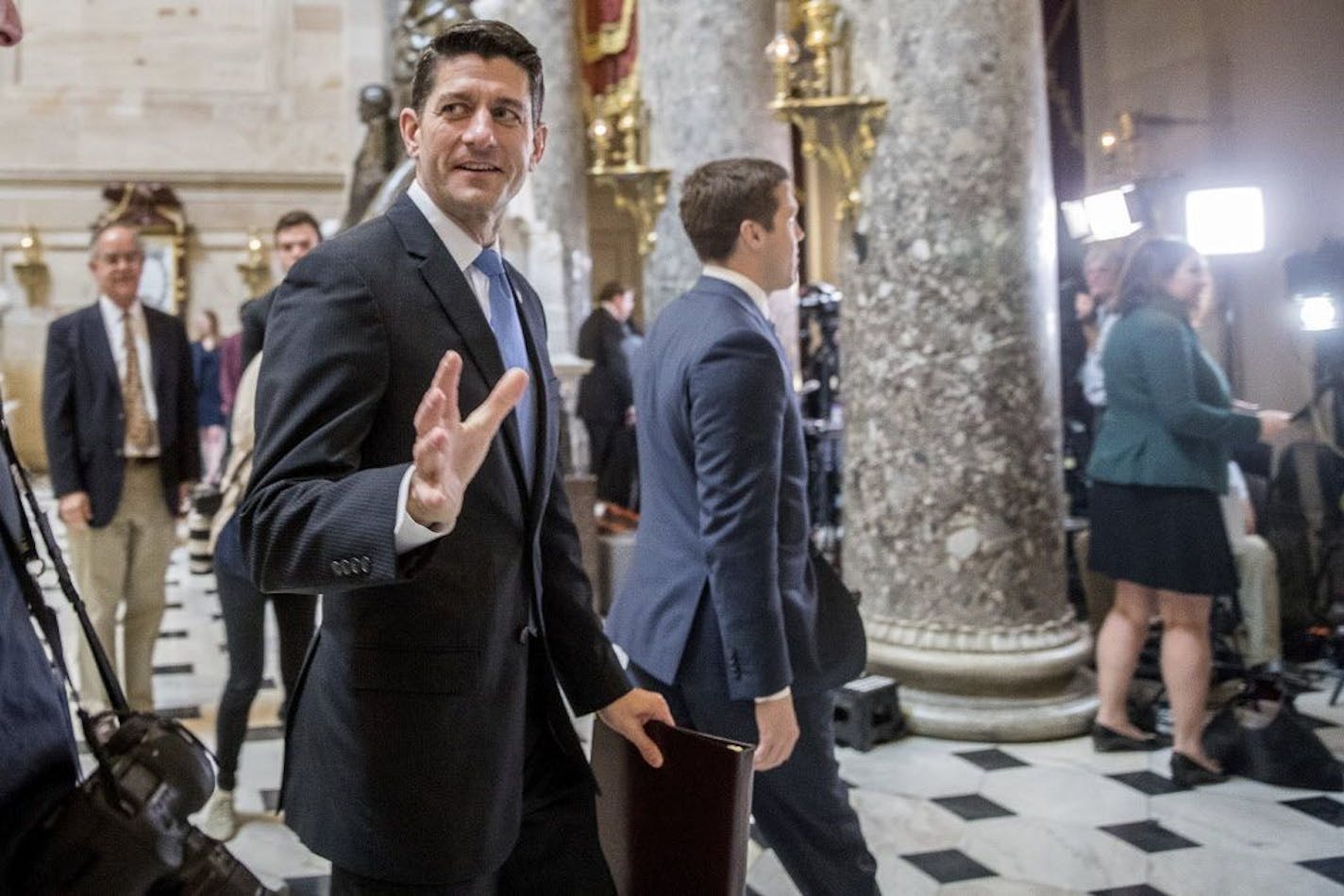 House Speaker Paul Ryan of Wis. greets guests as he walks to the House Chamber on Capitol Hill in Washington, Thursday, May 4, 2017. The Republican health care bill, a top-flight priority the party nearly left for dead six weeks ago, headed toward a House showdown vote.