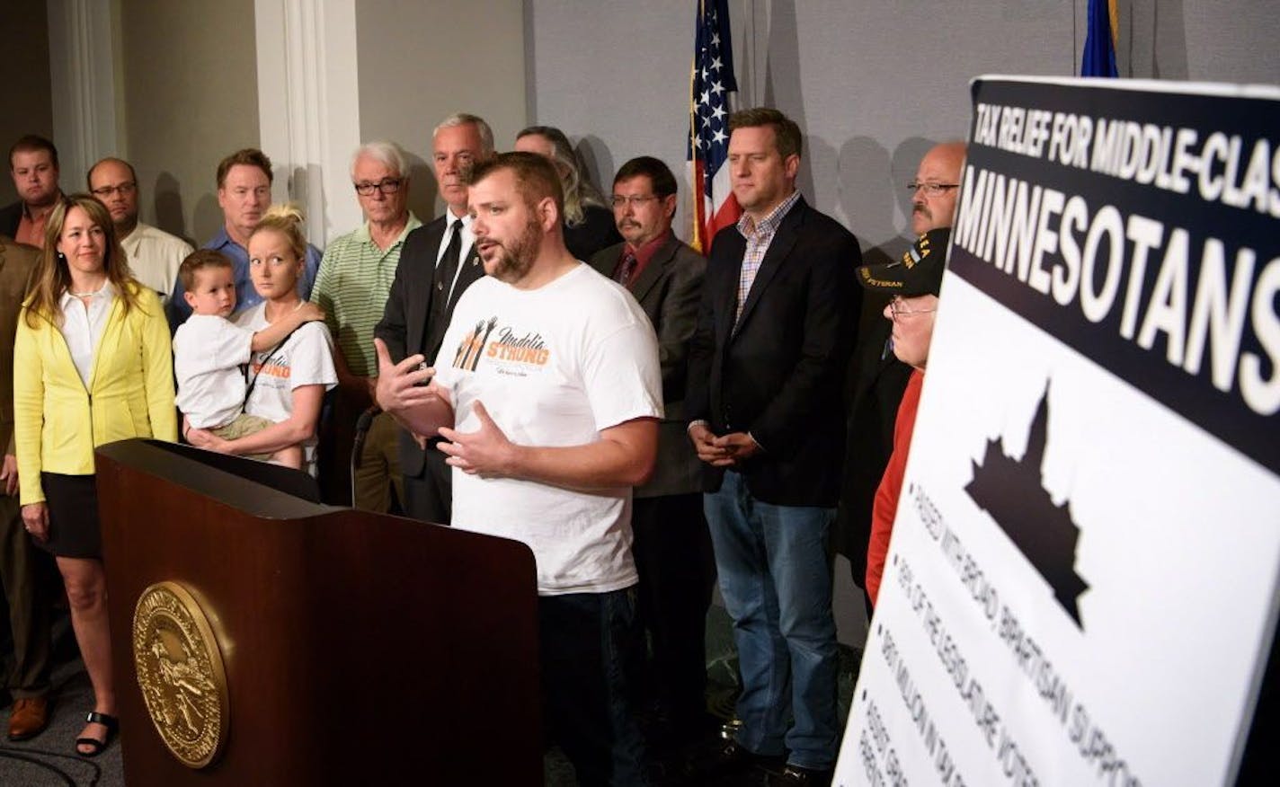 Ryan Visher, who lost his floral shop in the Madelia fire, says during a news conference that he needs the relief provided in the tax bill, Monday, June 6, 2016 in St. Paul, Minn.