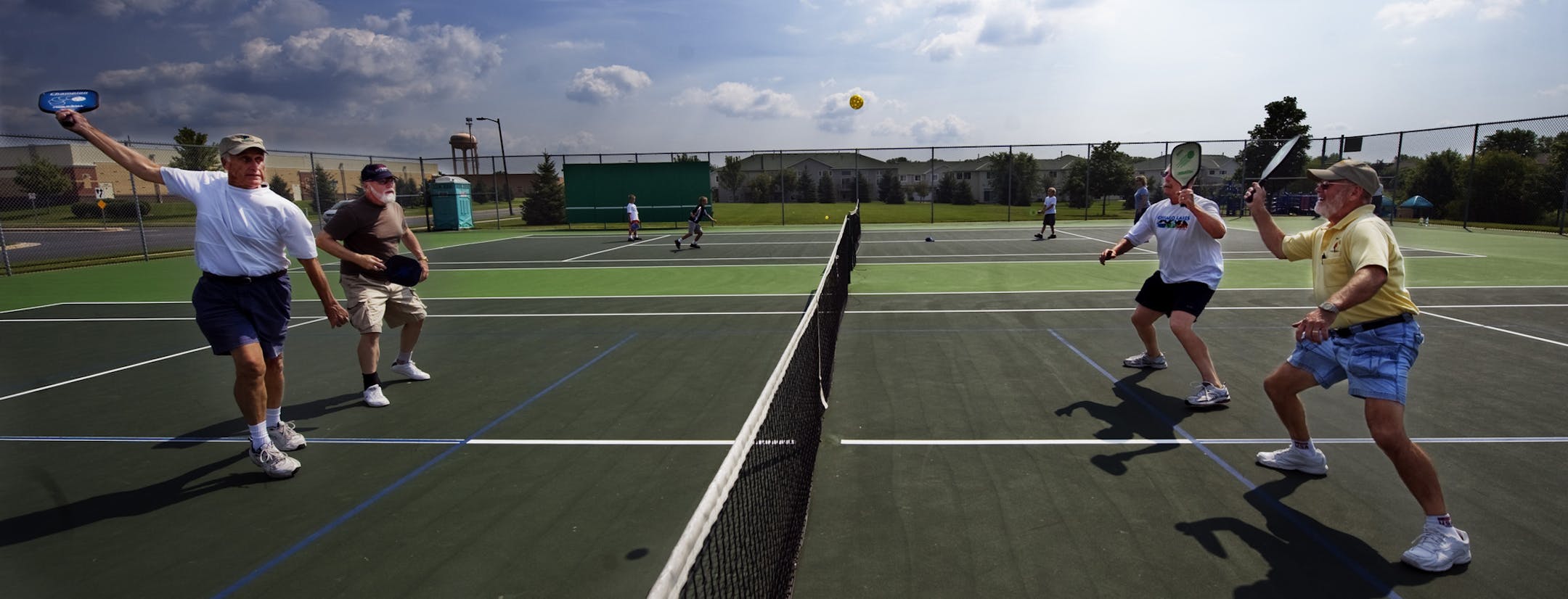 DAVID BREWSTER ‚Ä¢ dbrewster@startribune.com Thursday 07/29/10 Rosemount A tennis court in a Rosemount park has been converted into a pickleball court. Retired truck driver Terry Taylor, 69, gives free lessons each week and is trying to push the city to create an indoor court in the community center gym so avid players can enjoy the sport year round. IN THIS PHOTO: ] Pickleballers volley the ball in play from close in to the "kitchen" (blue line to the net). ORG XMIT: MIN2013080