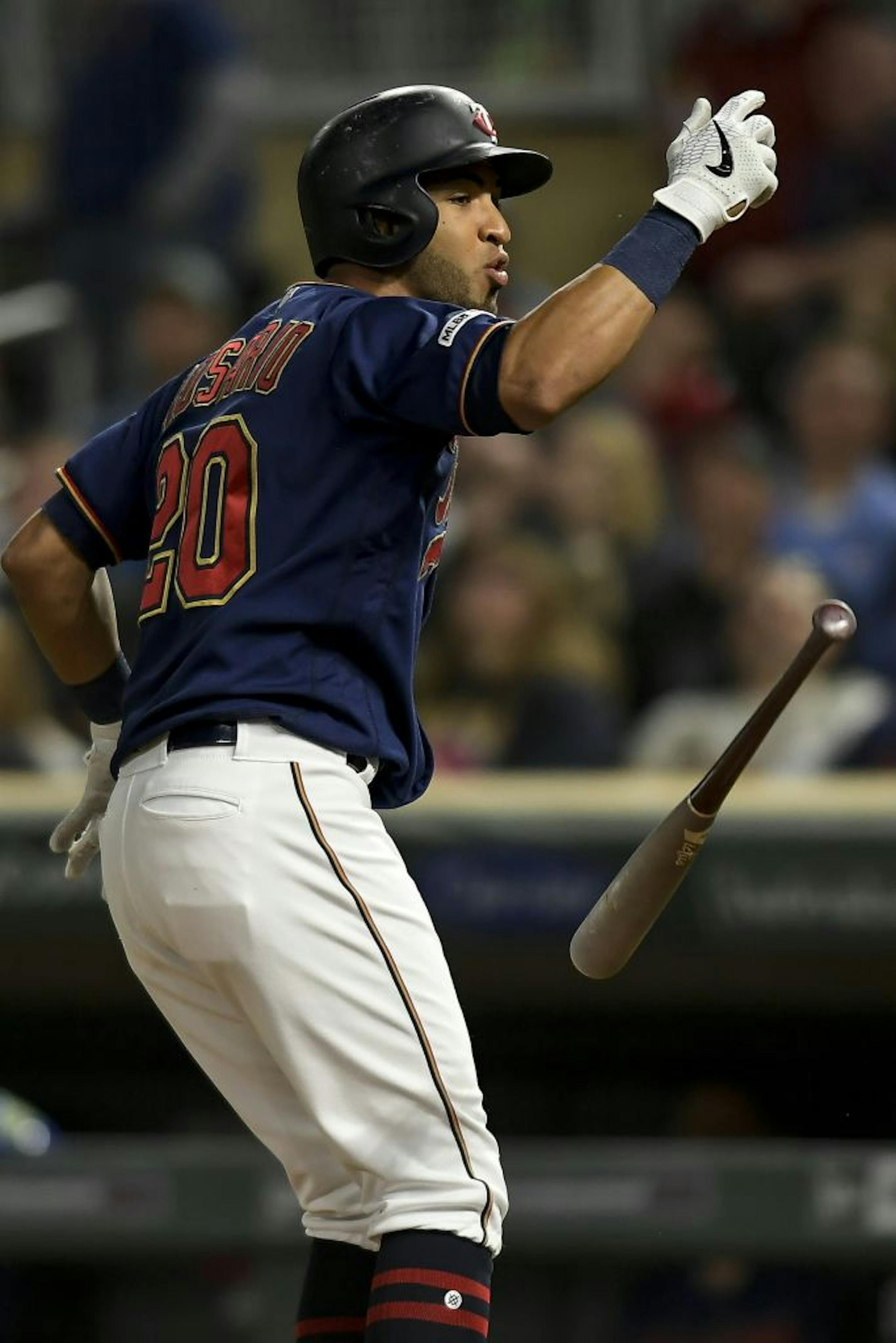 Minnesota Twins left fielder Eddie Rosario (20) vented his frustration to the home plate umpire as he popped out in the bottom of the eight after he believed he should have been walked earlier in his at-bat.