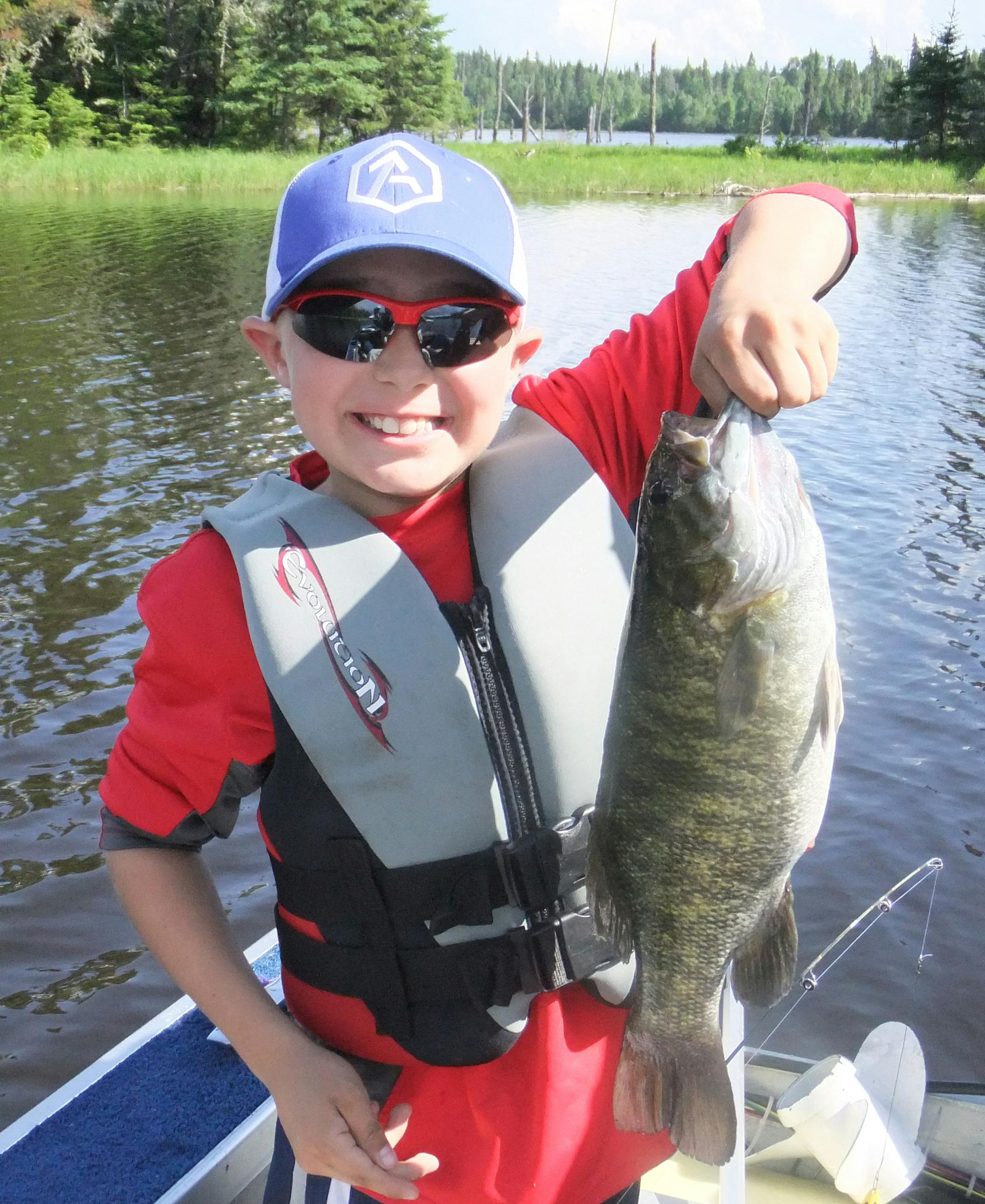 Charlie Terwilliger, 10, of Eden Prairie caught this 20-inch whopper smallmouth bass at Lac Seul in northwestern Ontario.