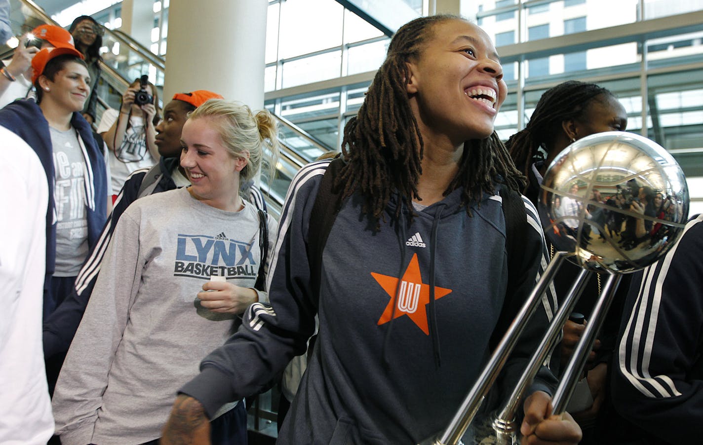 Carrying the Championship trophy, Minnesota Lynx Seimone Augustus and the team was welcomed by fans upon their arrival at the Humphrey Terminal, Friday, October 11, 2012 in Bloomington, MN. The Minnesota Lynx won their second WNBA title in three years beating the Atlanta Dream 86-77 on Thursday. (ELIZABETH FLORES/STAR TRIBUNE) ELIZABETH FLORES &#x2022; eflores@startribune.com