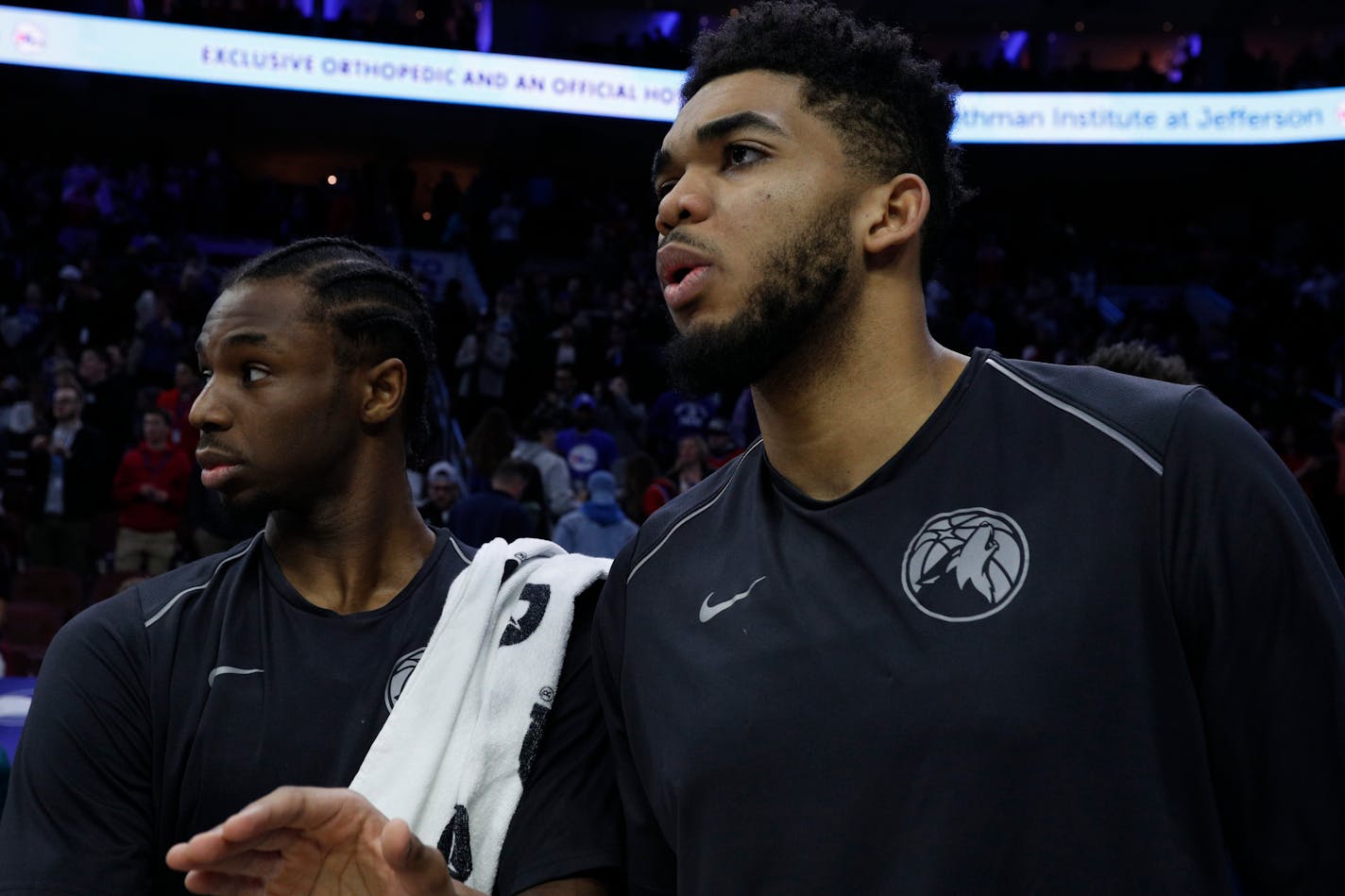 Minnesota Timberwolves' Karl-Anthony Towns, right, and Andrew Wiggins, left, looks on during the second half of an NBA basketball game against the Philadelphia 76ers, Saturday, March 24, 2018, in Philadelphia. The 76ers won 120-108. (AP Photo/Chris Szagola)