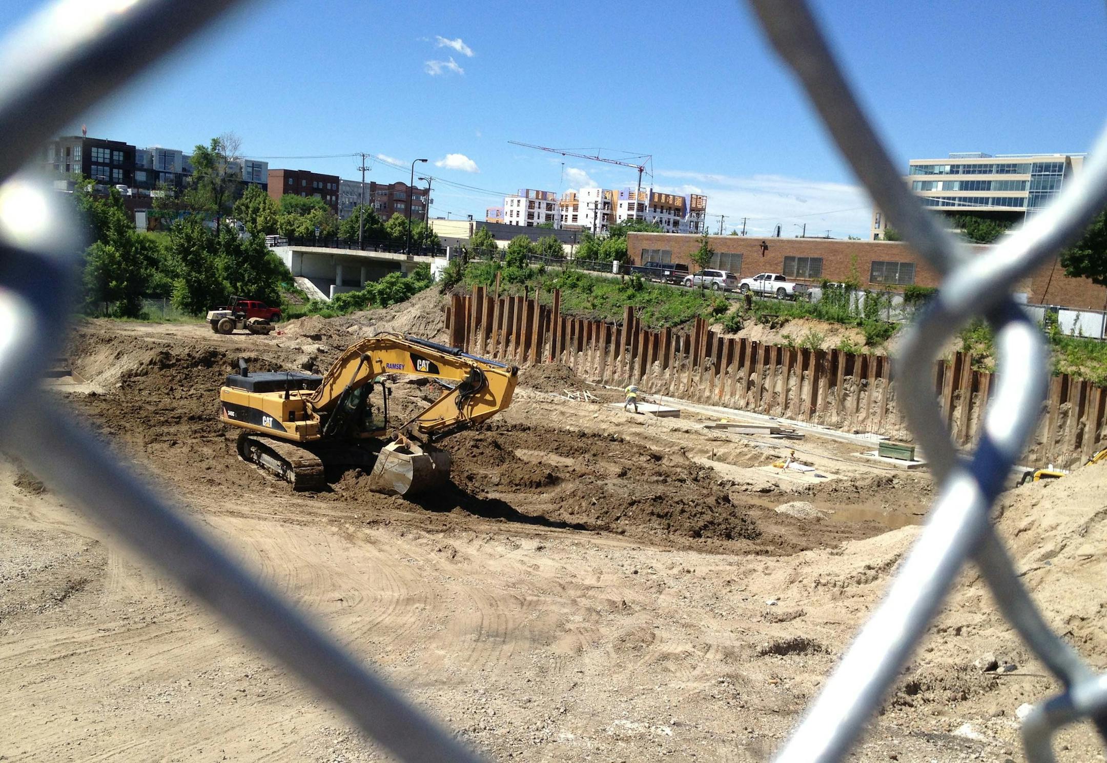 Construction of the second phase of the Elan Uptown apartments on 28th and Dupont Avenue in the Uptown neighborhood helped boost housing construction nearly 40 percent during June. Such multi-family buildings accounted for half of all housing construction last month. Photo by Jim Buchta/Star Tribune