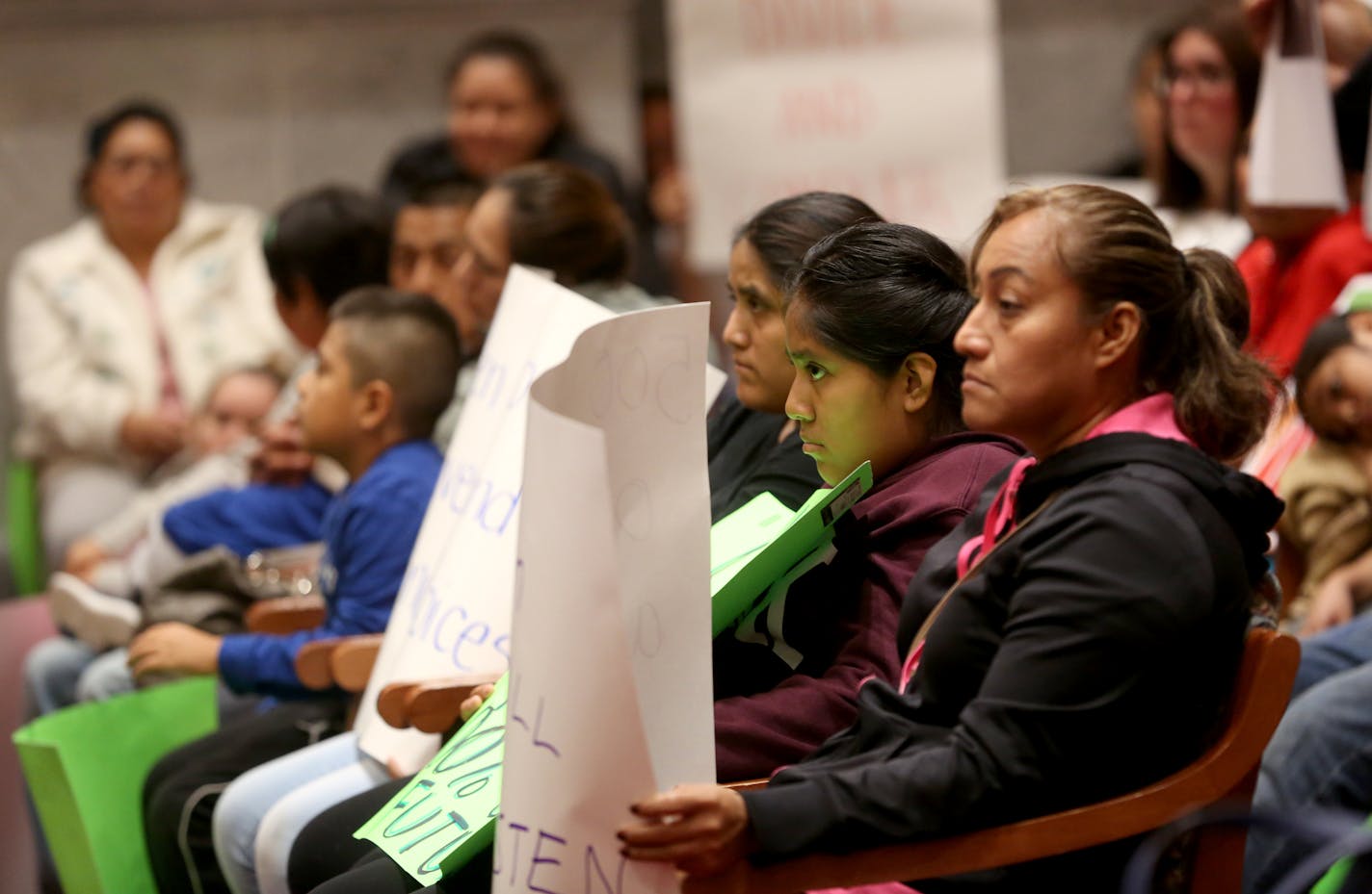 Supporters, families and staff of Aurora Charter School filled the Minneapolis City Council chambers Friday morning to voice their concerns about the homeless encampment being moved near their school. ] (KYNDELL HARKNESS/STAR TRIBUNE) kyndell.harkness@startribune.com Contentious meeting at the Minneapolis City Council over the placement of the homeless encampment near Aurora Charter School in Minneapolis, Min., Friday, September 21, 2018.