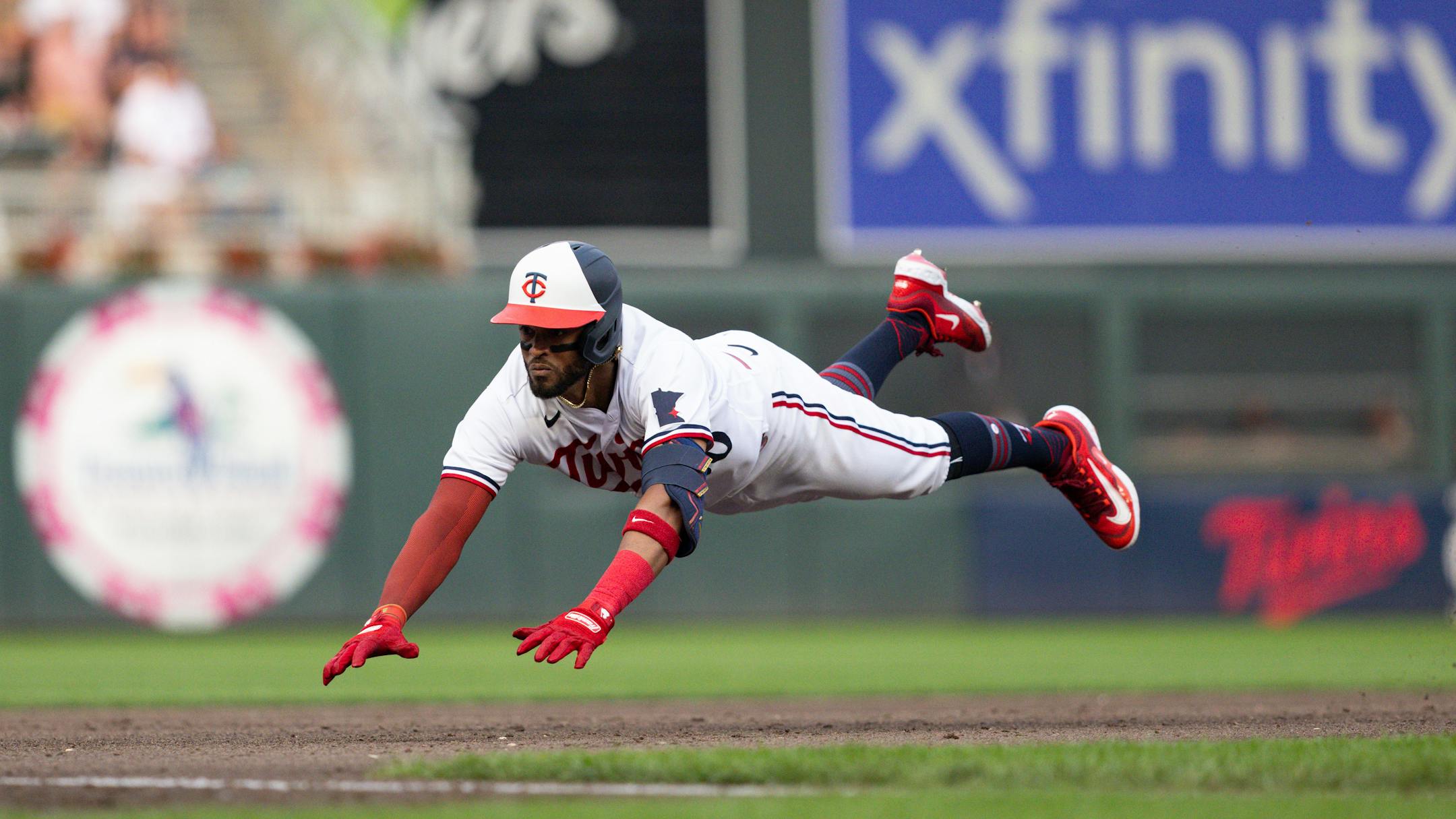 Minnesota Twins Willi Castro to slides into third base against the Detroit Tigers in the fourth inning of a baseball game on Thursday, June 15, 2023, in Minneapolis. (AP Photo/Bailey Hillesheim)