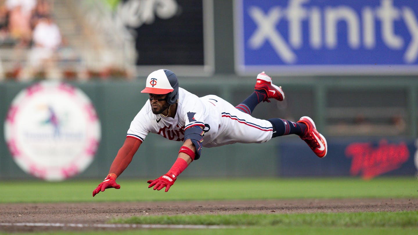 Minnesota Twins Willi Castro to slides into third base against the Detroit Tigers in the fourth inning of a baseball game on Thursday, June 15, 2023, in Minneapolis. (AP Photo/Bailey Hillesheim)