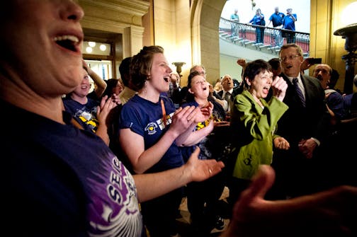 CORRECTS SOURCE AFSCME and SEIU members cheered Senator Sandy Pappas and Rep. Michael Nelson, co authors of the daycare unionization bill after passage of the bill 68-66, Monday, May 20, 2013.