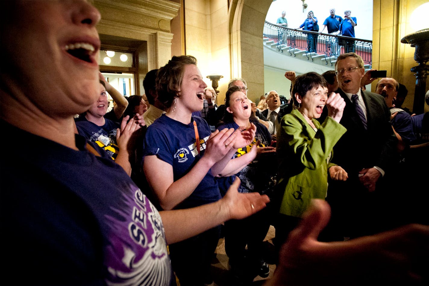 CORRECTS SOURCE AFSCME and SEIU members cheered Senator Sandy Pappas and Rep. Michael Nelson, co authors of the daycare unionization bill after passage of the bill 68-66, Monday, May 20, 2013.