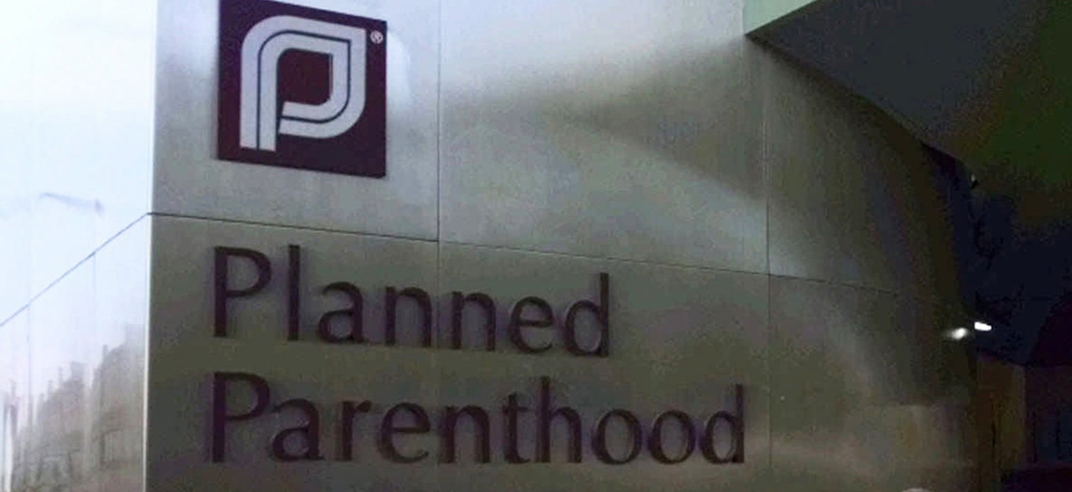 Guests arrive at the dedication for the Planned Parenthood of Massachusetts headquarters on Commonwealth Avenue in Boston, Thursday, June 25, 1998. The headquarters was designed with many modern security devices, including bullet-resistant windows, metal detectors and many high-tech monitoring devices. On Dec. 30, 1994, two workers were killed by an anti-abortion gunman at two Boston-area abortion clinics. (AP Photo/Charles Krupa) ORG XMIT: BX114