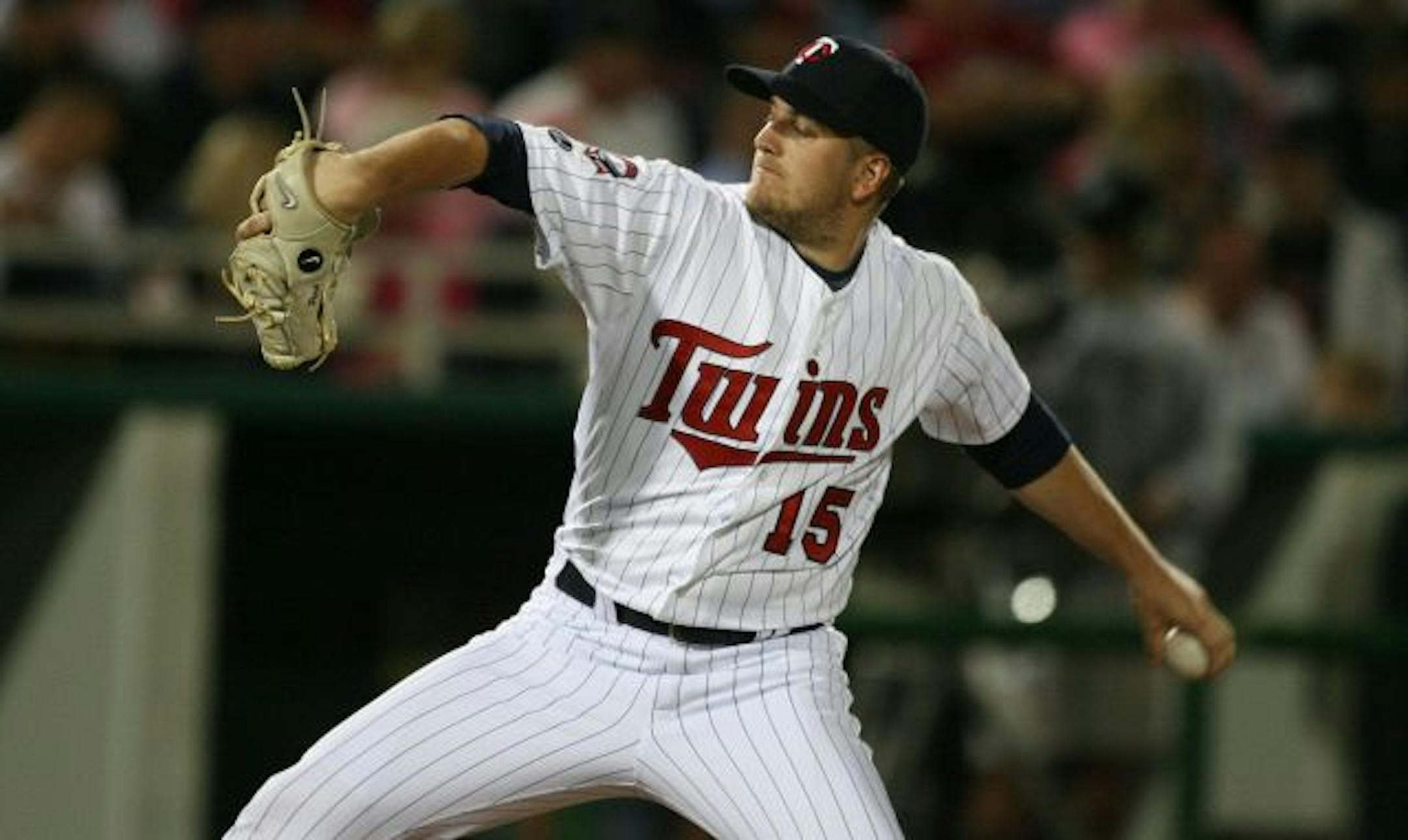 Twins lefthander Glen Perkins delivered a pitch during the first inning against Boston. He gave up a hit to Dustin Pedroia, then retired the side on three fly balls.