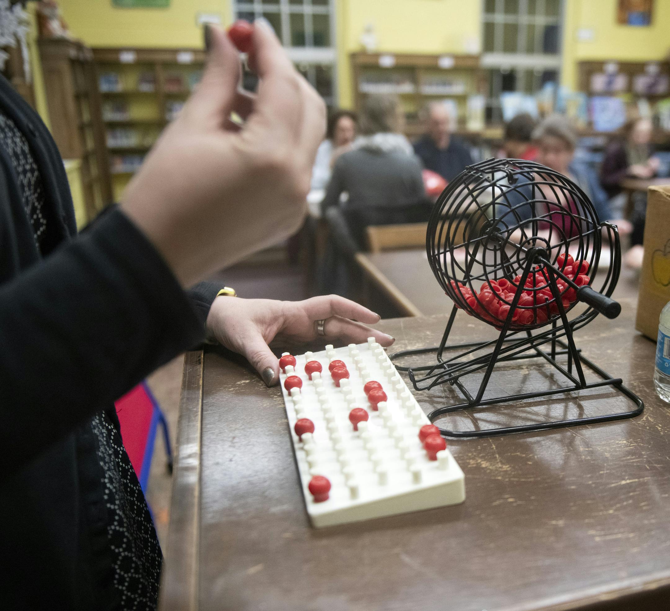 Honora Rodriquez, Adult Services Librarian, called out bingo numbers. ] COURTNEY DEUTZ &#x2022; courtney.deutz@startribune.com on Thursday, February 21, 2019 at the South St. Paul Public Library. "Winter Reads Book Bingo" allowed players to win books and DVD's.