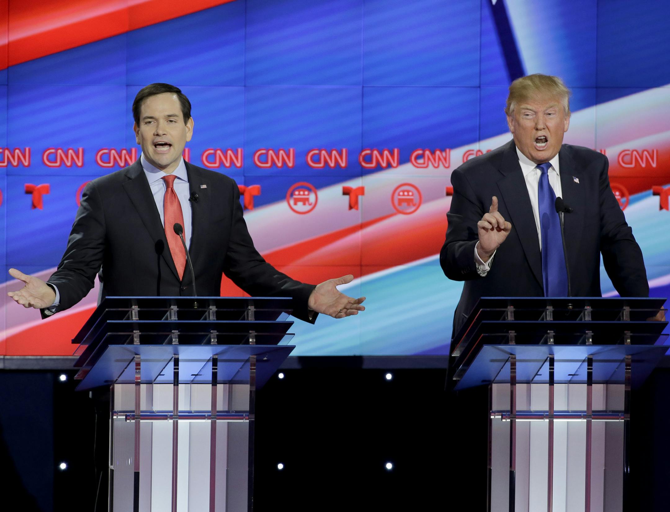 Republican presidential candidate, Sen. Marco Rubio, R-Fla., left, and Republican presidential candidate, businessman Donald Trump both speak during a Republican presidential primary debate at The University of Houston, Thursday, Feb. 25, 2016, in Houston. (AP Photo/David J. Phillip)