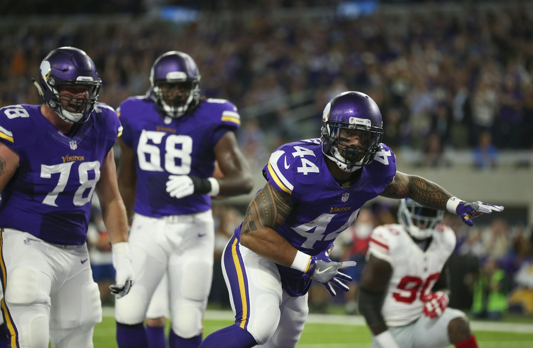 Vikings running back Matt Asiata celebrated his 1-yard touchdown run in the first quarter.